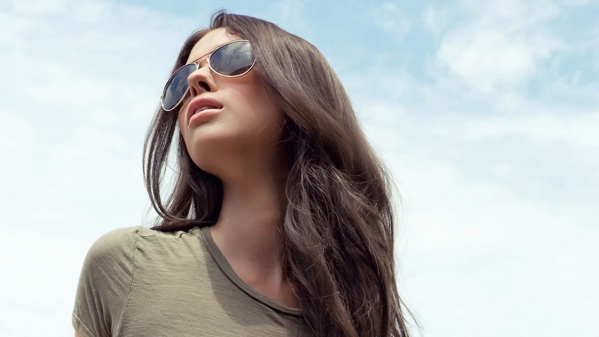 Woman Wearing Green Scoop Neck Top With Gold Framed Aviator