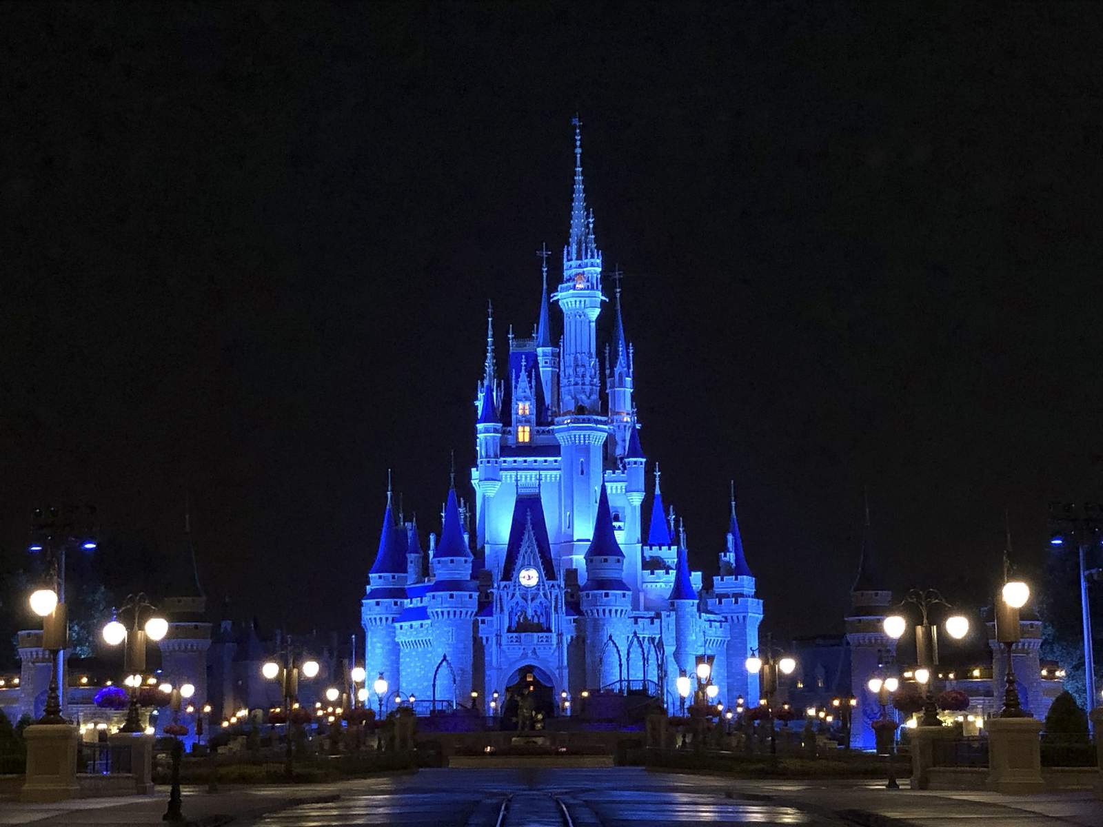 Cinderella's Castle shines in blue as Disney parks thank health