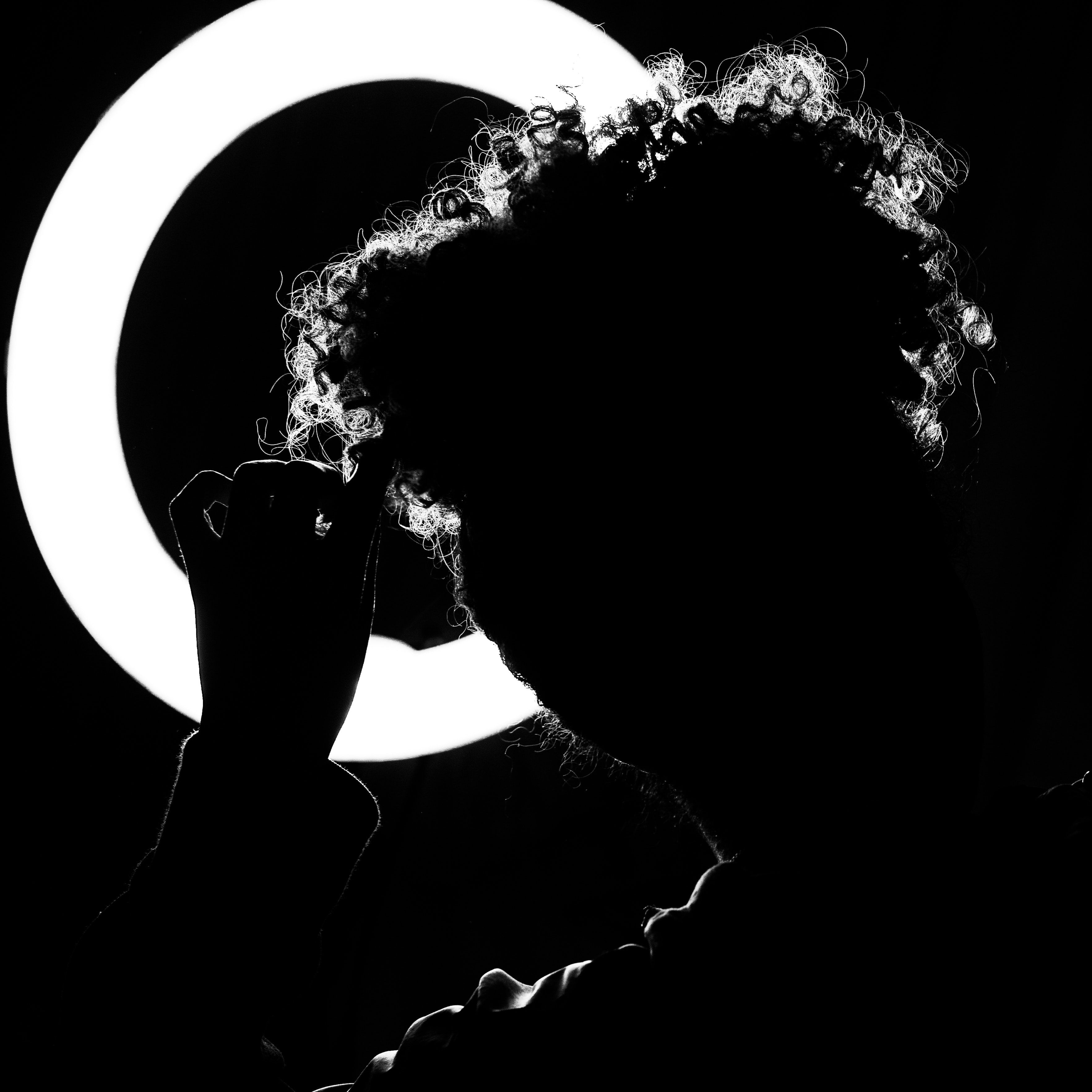 Silhouette of Person Facing Ring Light · Free