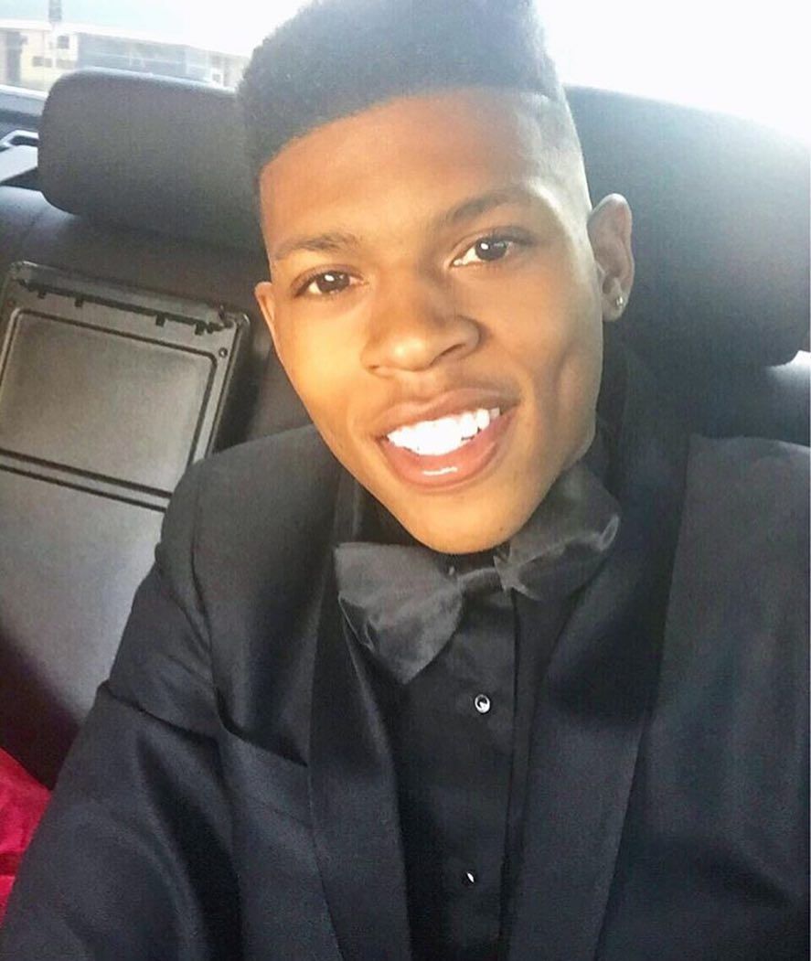 Bryshere Y. Gray wearing white shirt and black pants. Man crush