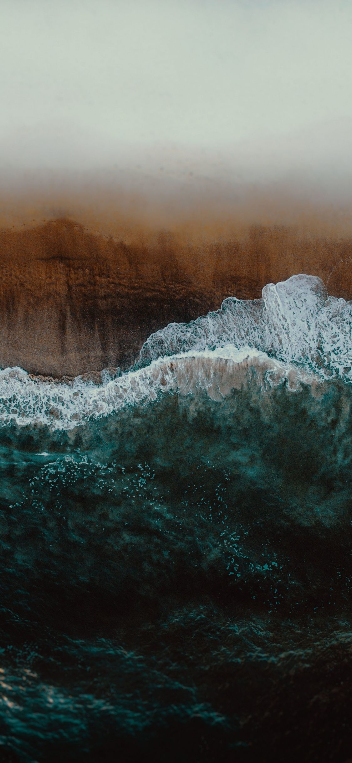 Download 1125x2436 wallpaper aerial view, sea waves, seashore