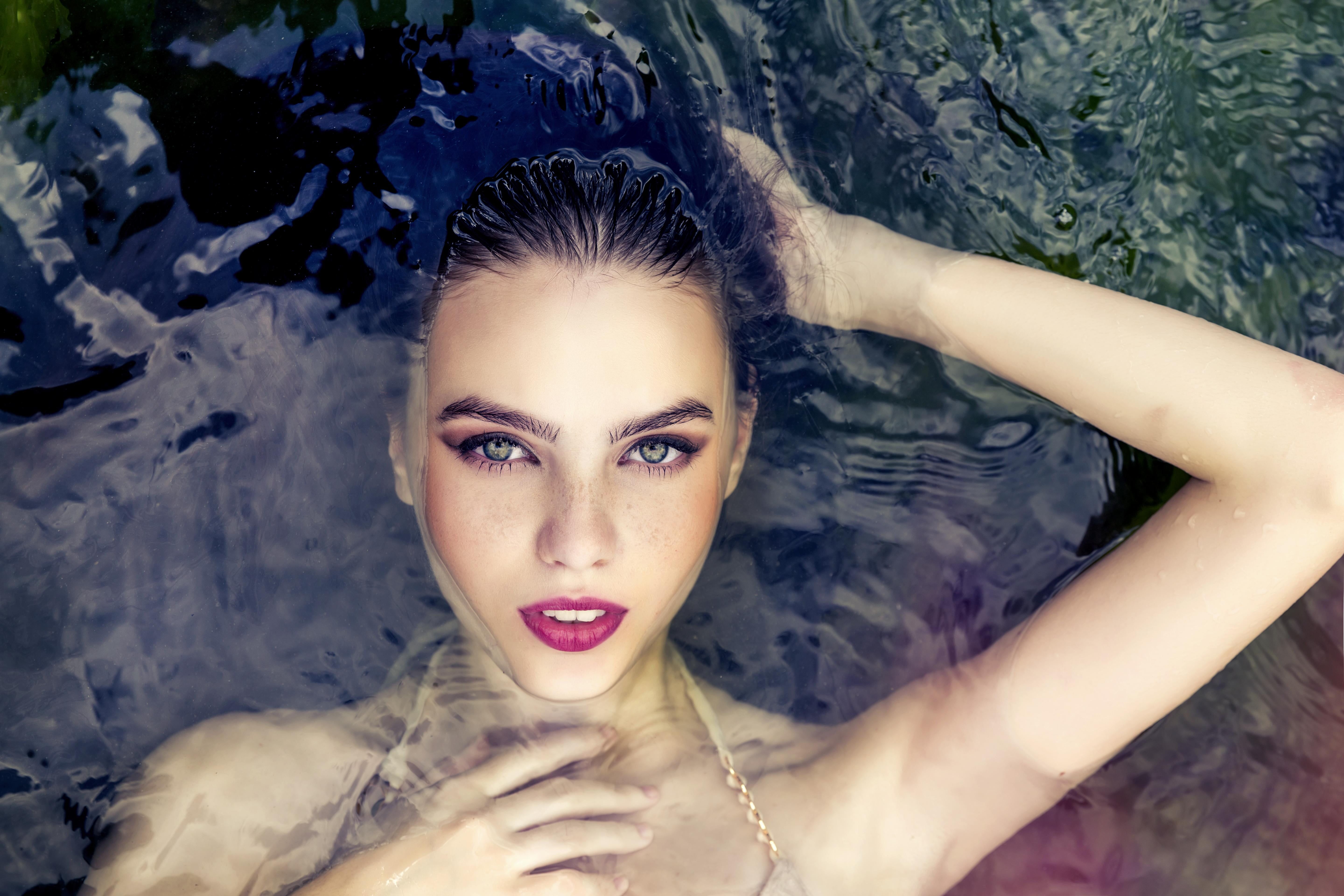 Woman floating on the water HD wallpaper