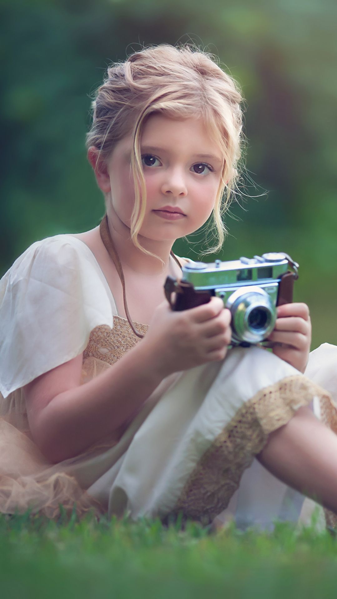 Picture Little girls Dark Blonde Camera sweet child sit 1080x1920