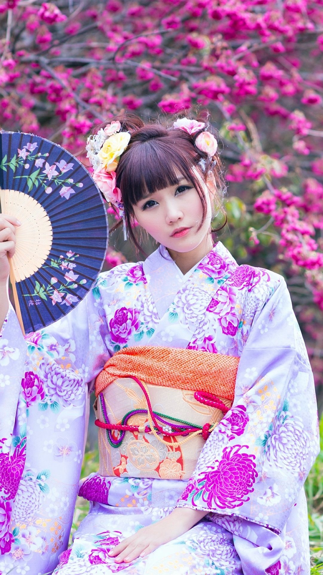 Beautiful Japanese girl in the garden, kimono, flowers, spring