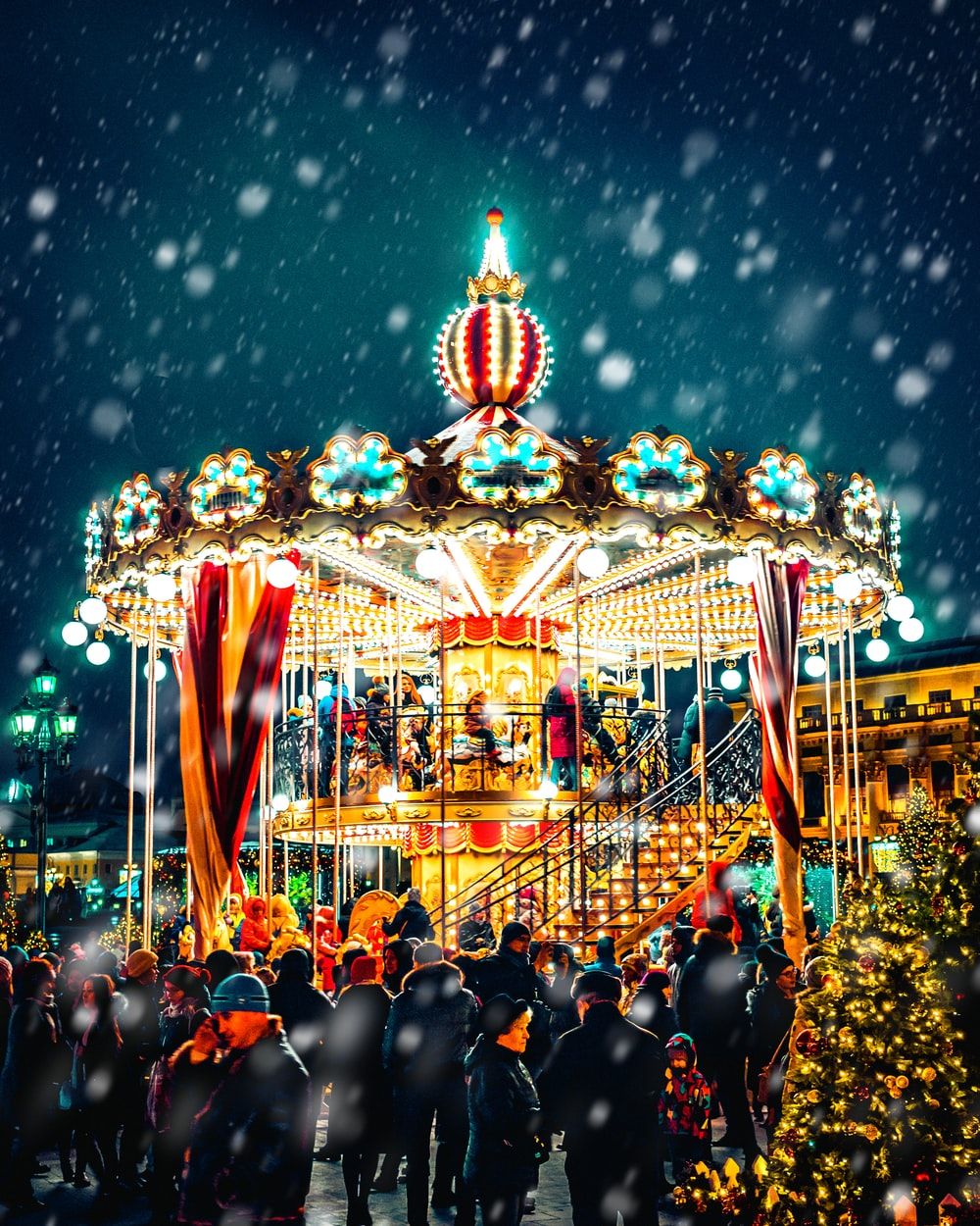 carousel with snow pouring down photo