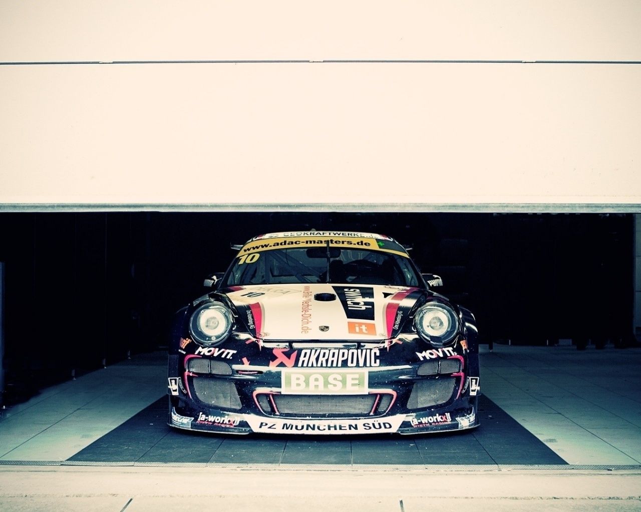 Racing Porsche in the Garage desktop PC and Mac wallpaper