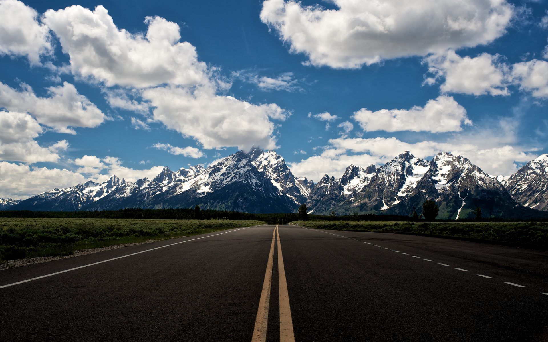 Empty Lanes, Highway, Rocky Mountains With Snow, Blue Sky