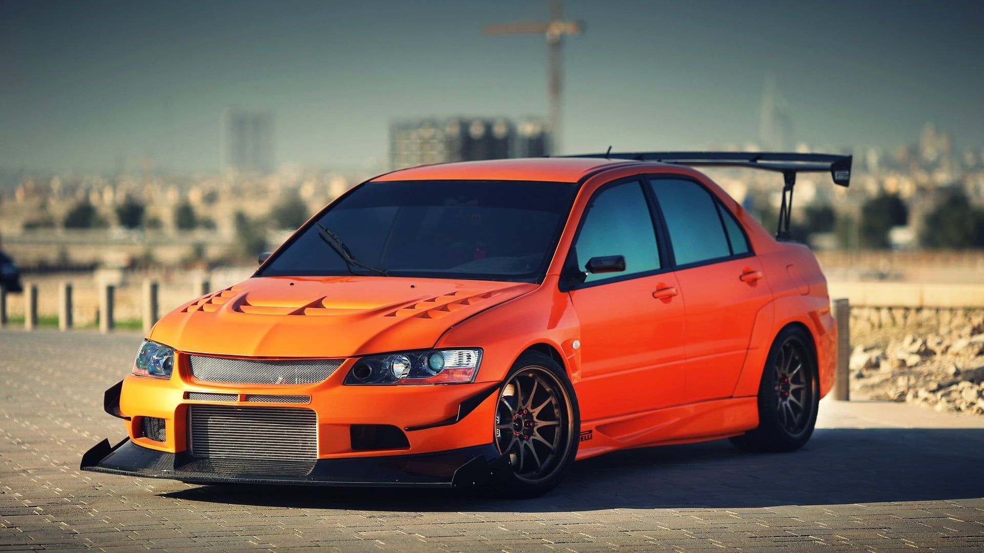 orange sedan #Mitsubishi Mitsubishi Lancer Evolution IX #car