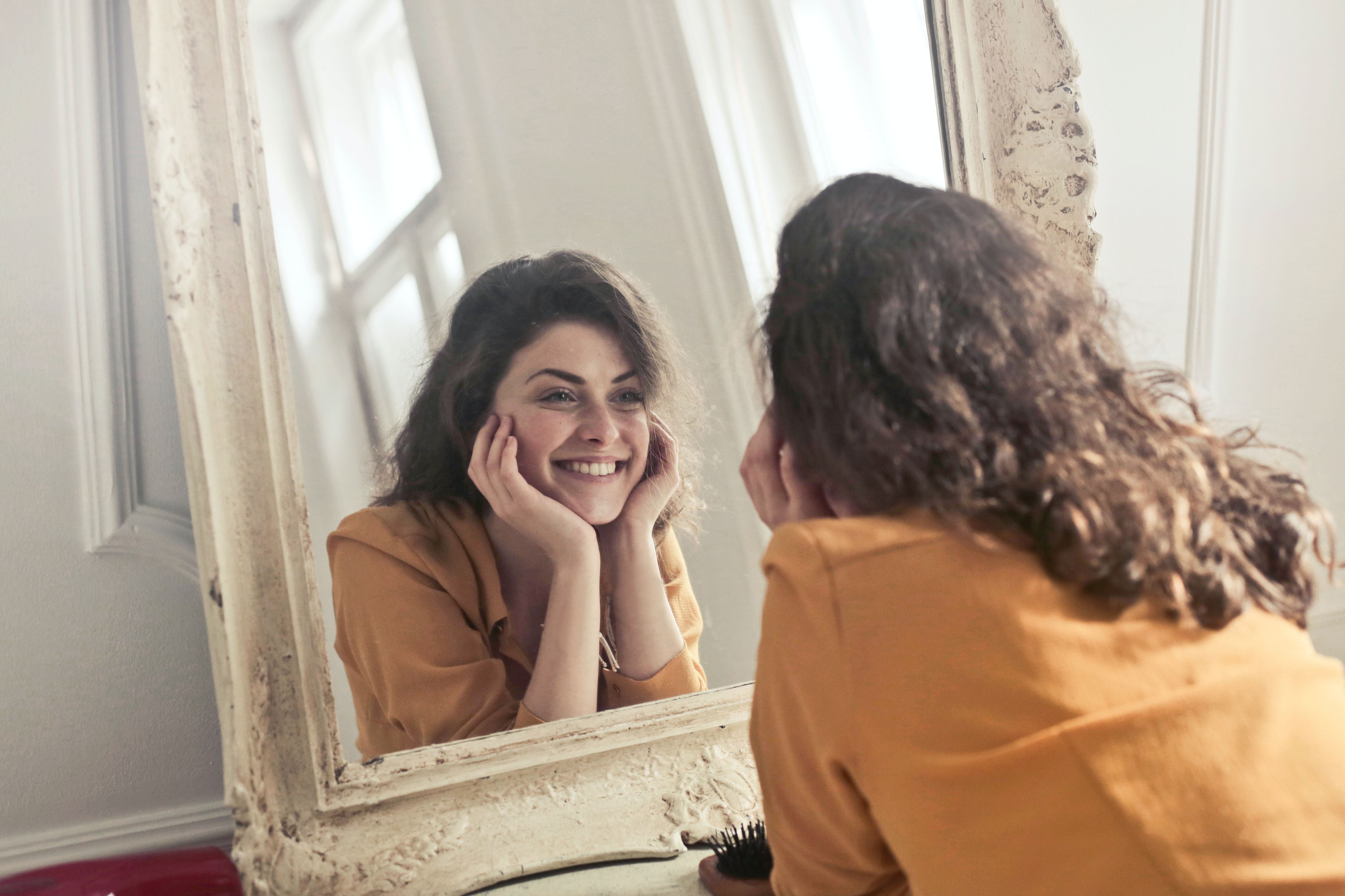 Photo of Woman Looking at the Mirror · Free