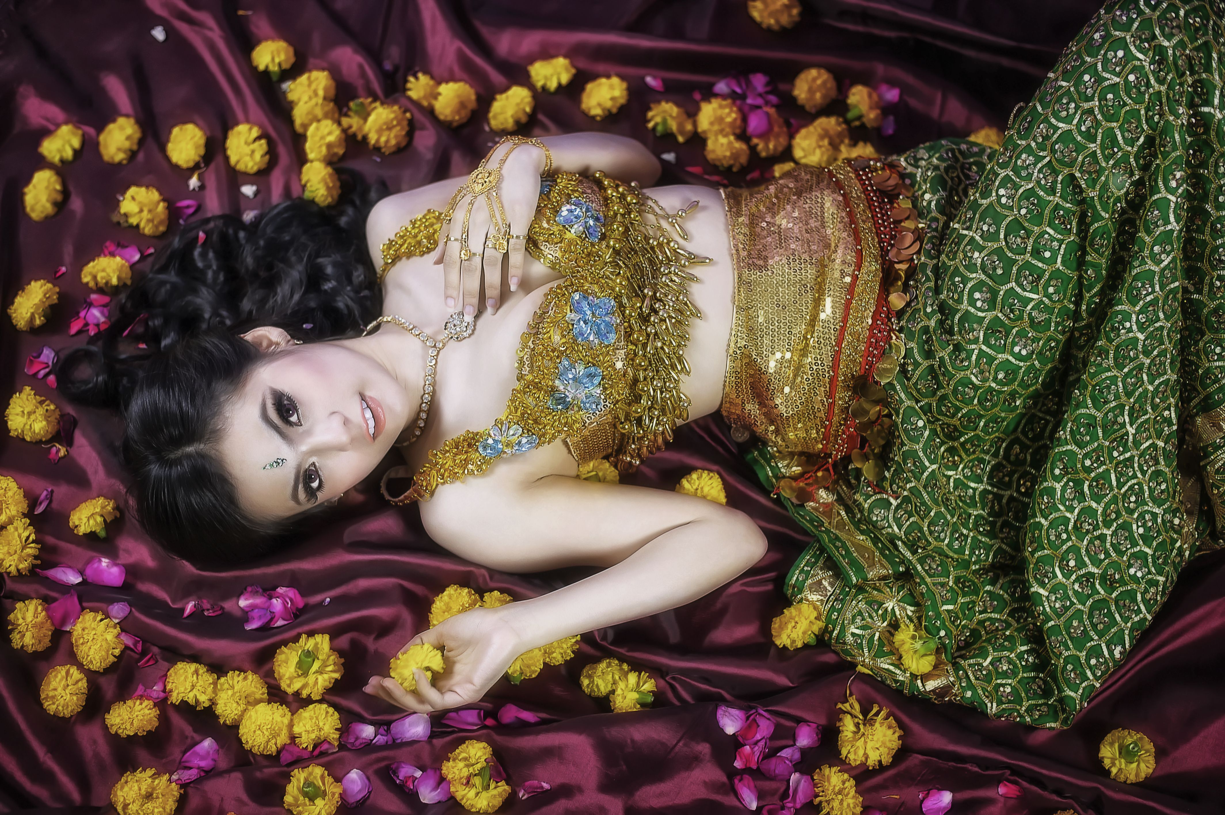 Beautiful young woman in traditional clothing with flowers 4k