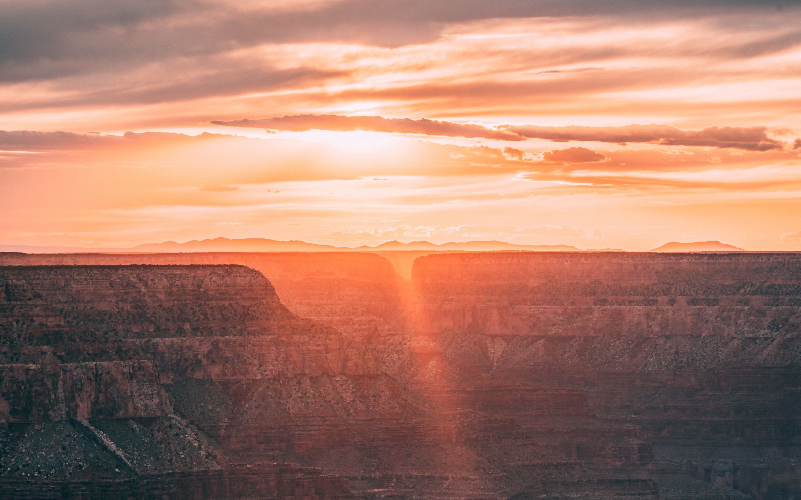 Download wallpaper 2560x1600 canyon, sunrise, sunshine, clouds