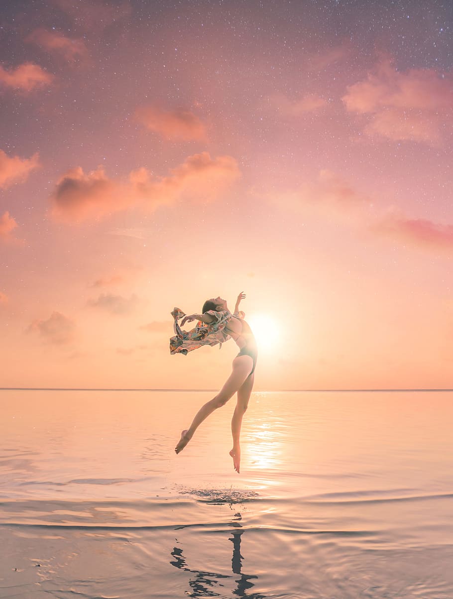HD wallpaper: woman jumping on body of water, dream, sunlight