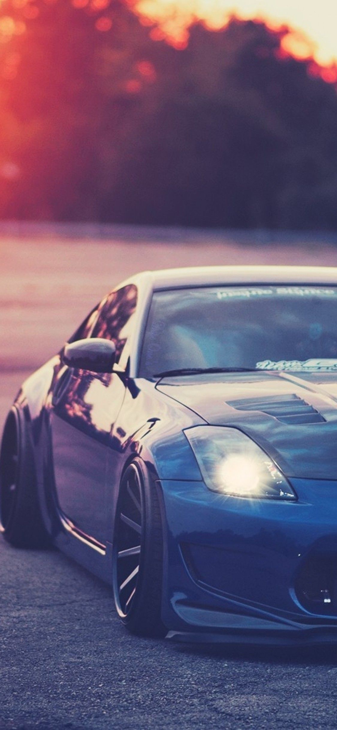 Download 1125x2436 Nissan 350z, Blue, Sunlight, Tuning, Cars
