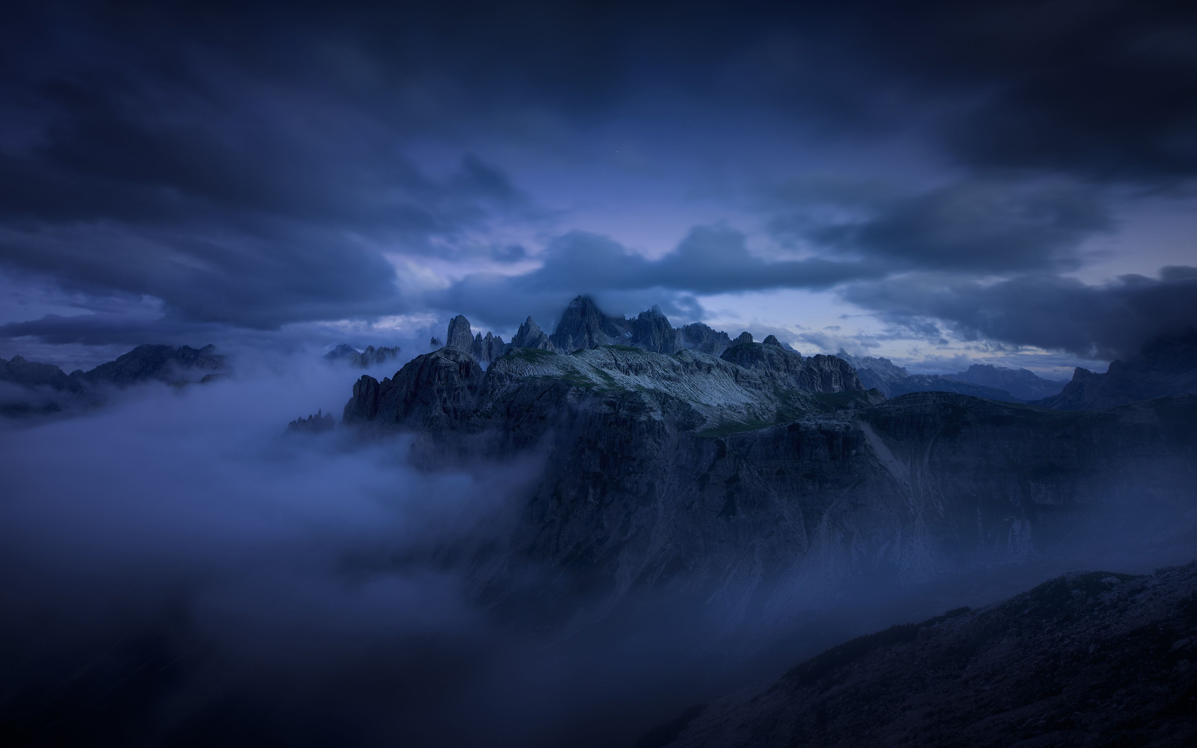 Dark Clouds over the Mountains 4k Ultra HD Wallpaper. Background
