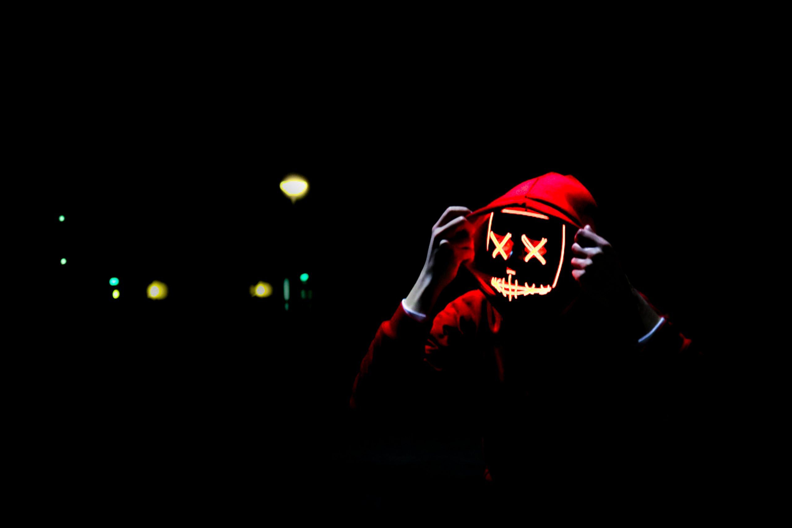 20 Game Wallpapers • Person wearing hoodie and neon mask