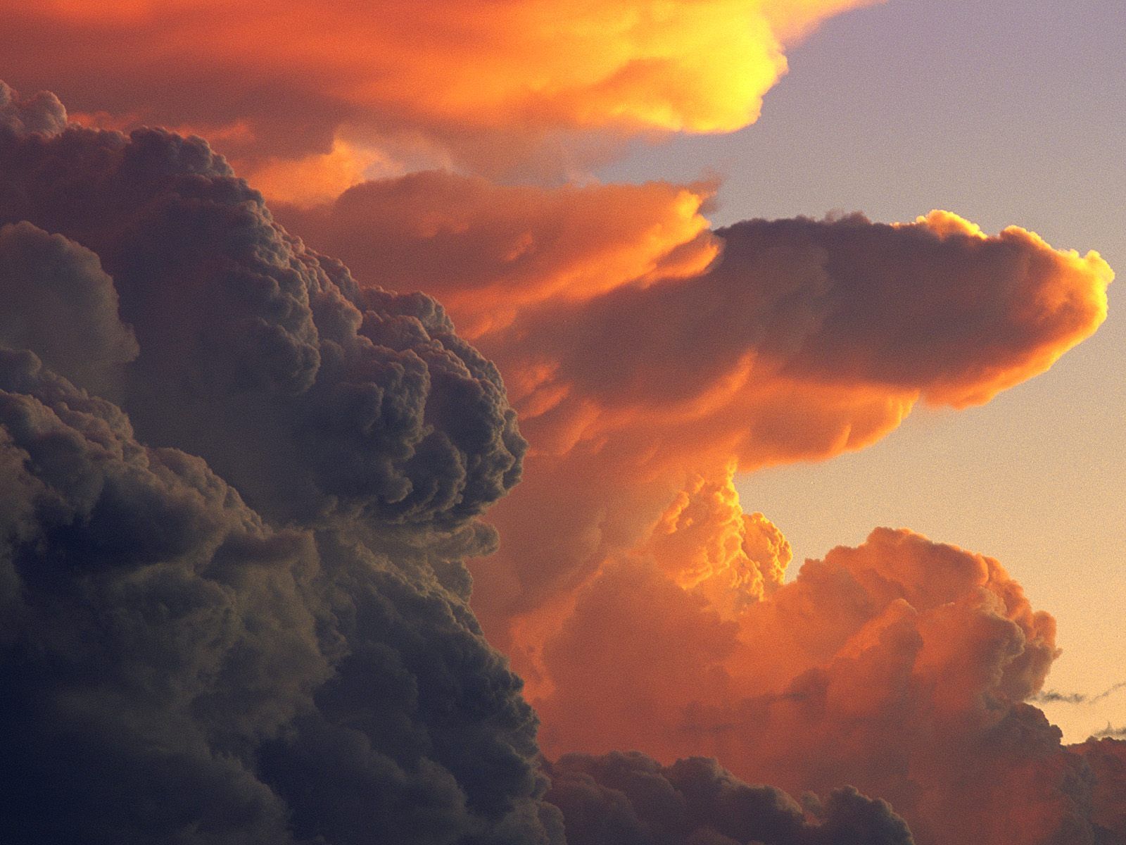 Cumulus Clouds At Sunset