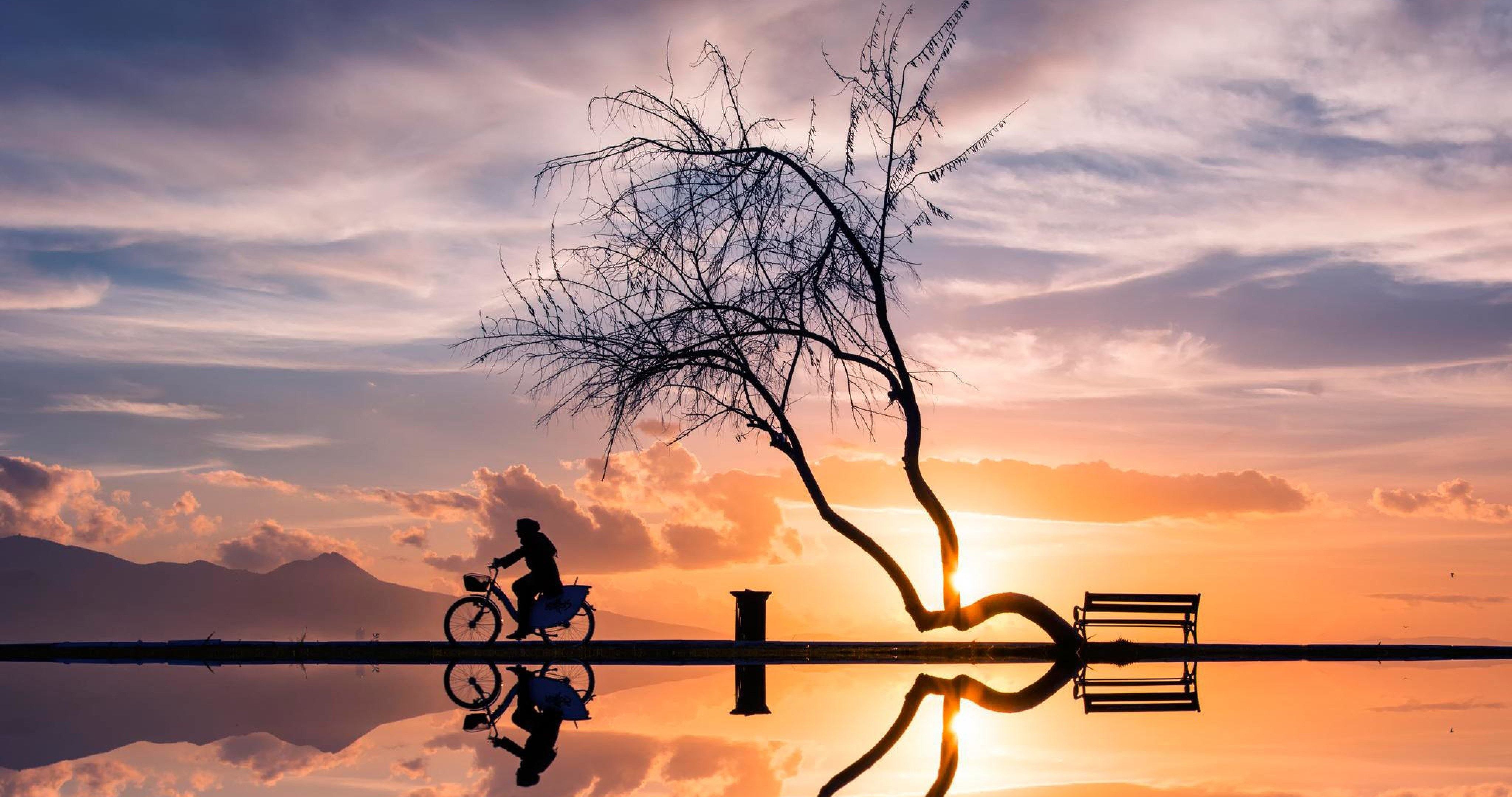 women on bycicle in sunset 4k ultra HD wallpaper High quality walls