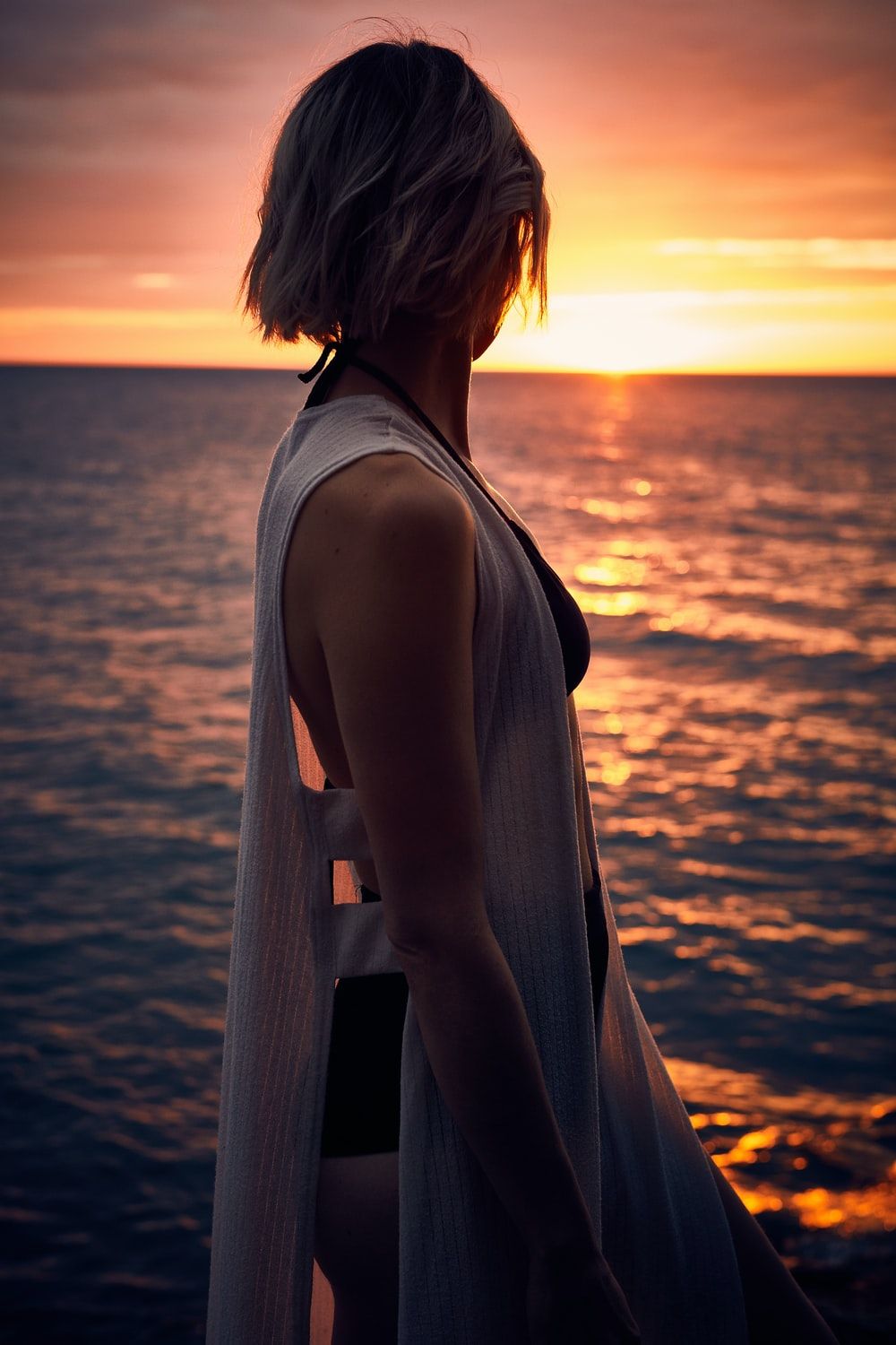 woman facing sideways at sunset photo