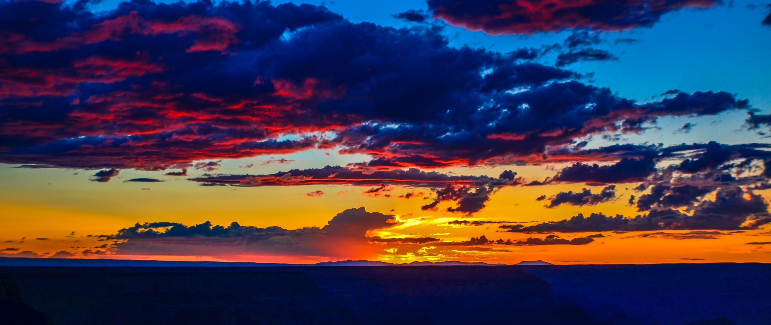 Download wallpaper 2560x1080 sunset, horizon, clouds, colorful