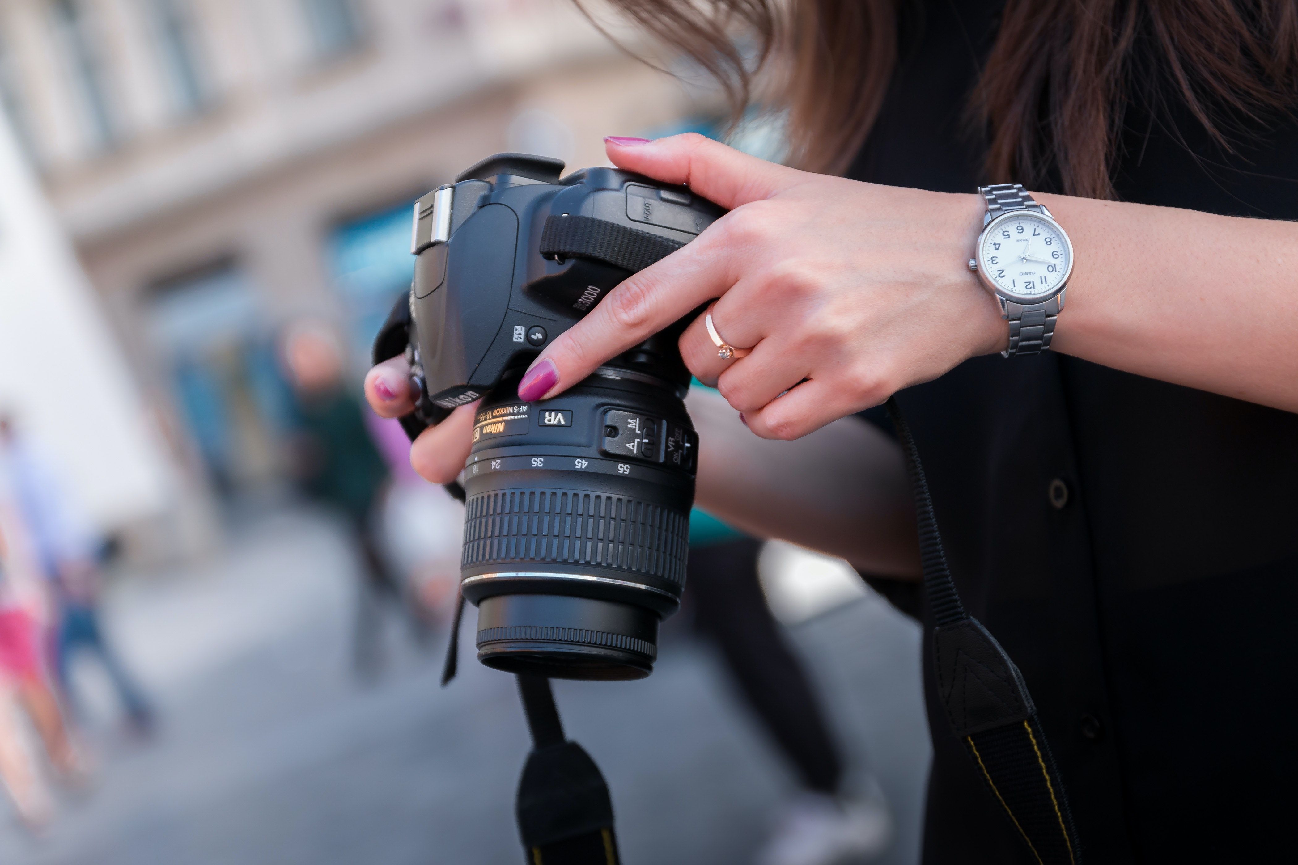 Woman Holding Black Dslr Camera · Free