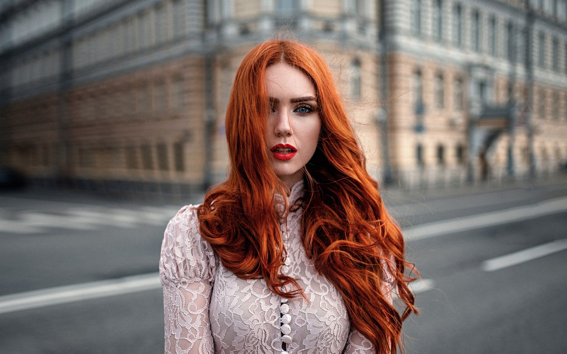 Wallpaper Red hair girl, wind, makeup, city, bokeh 1920x1200 HD