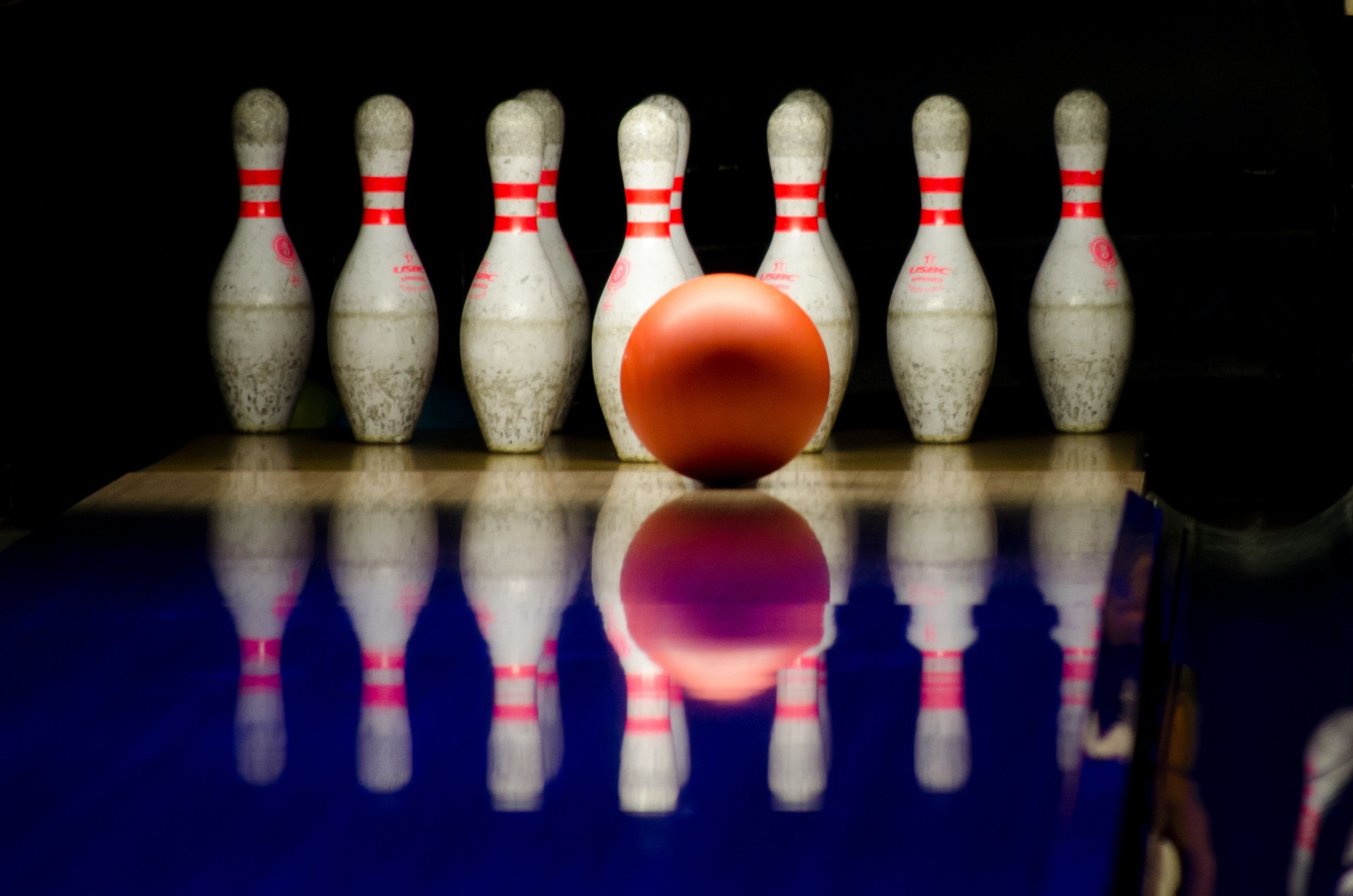 White Bowling Pins and Red Bowling Ball · Free