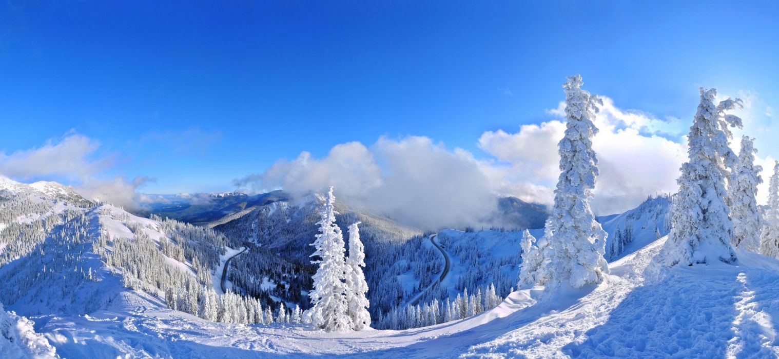 White clouds mountains frost blue sky panorama cold forest trees