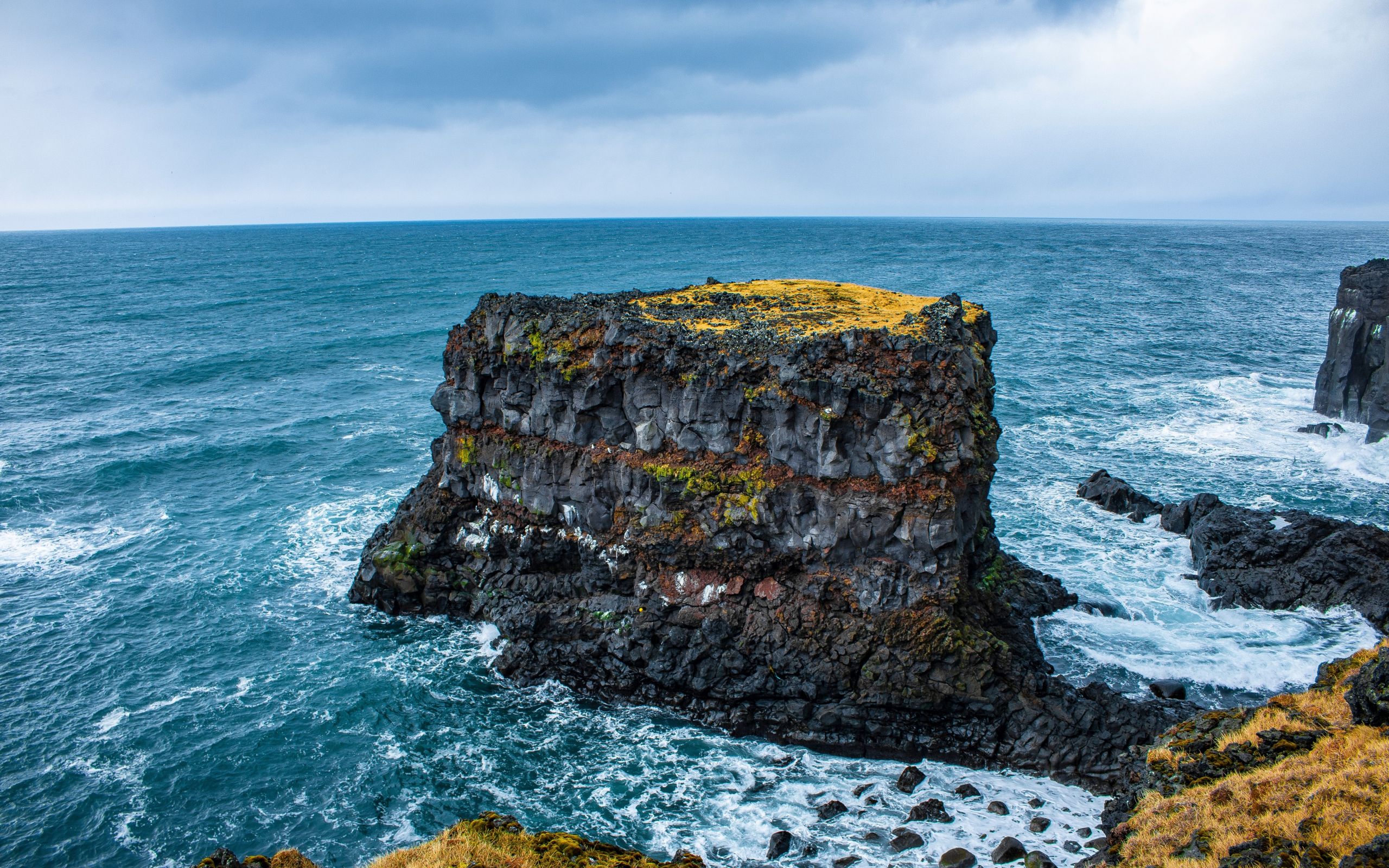 Download 2560x1600 wallpaper rock, cliff, coast, blue sea, iceland