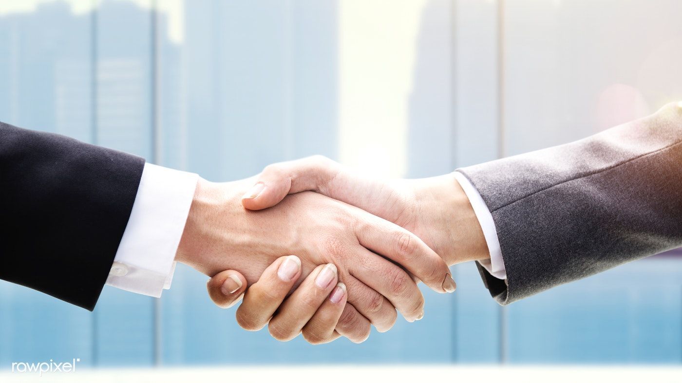 Download premium photo of Business people shaking hands