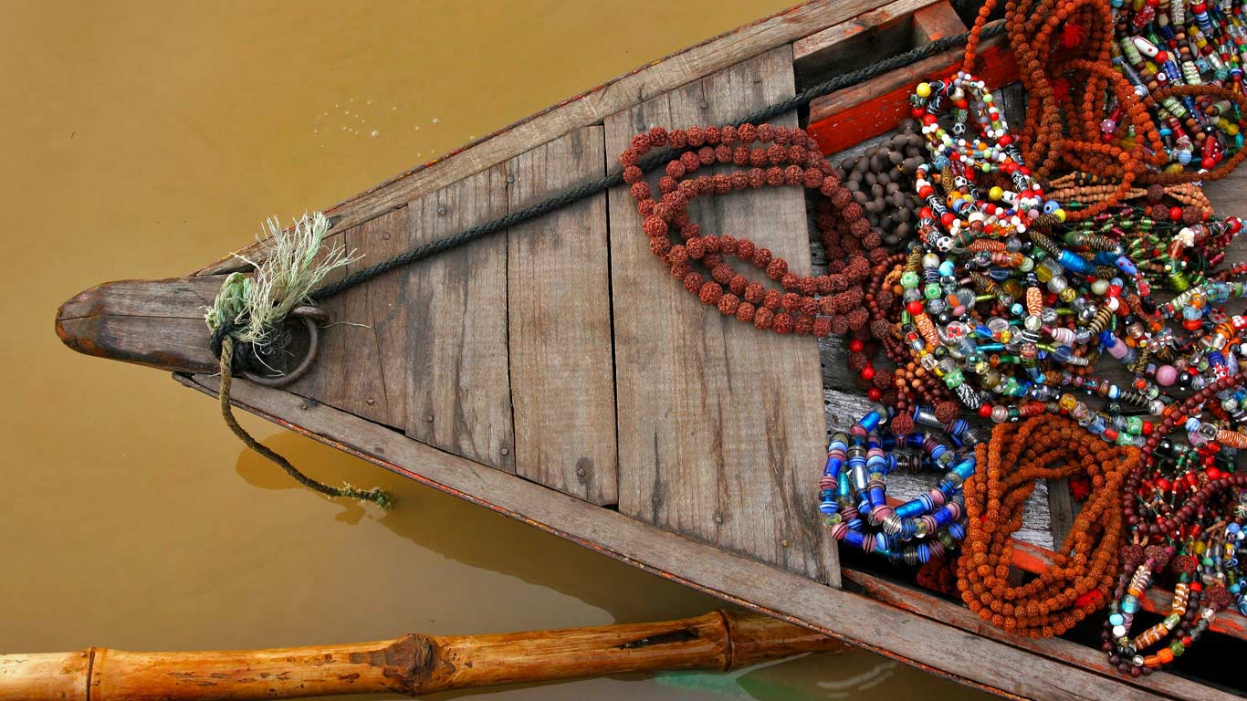 A boat in the Ganges river at Varanasi, India Wallpaper