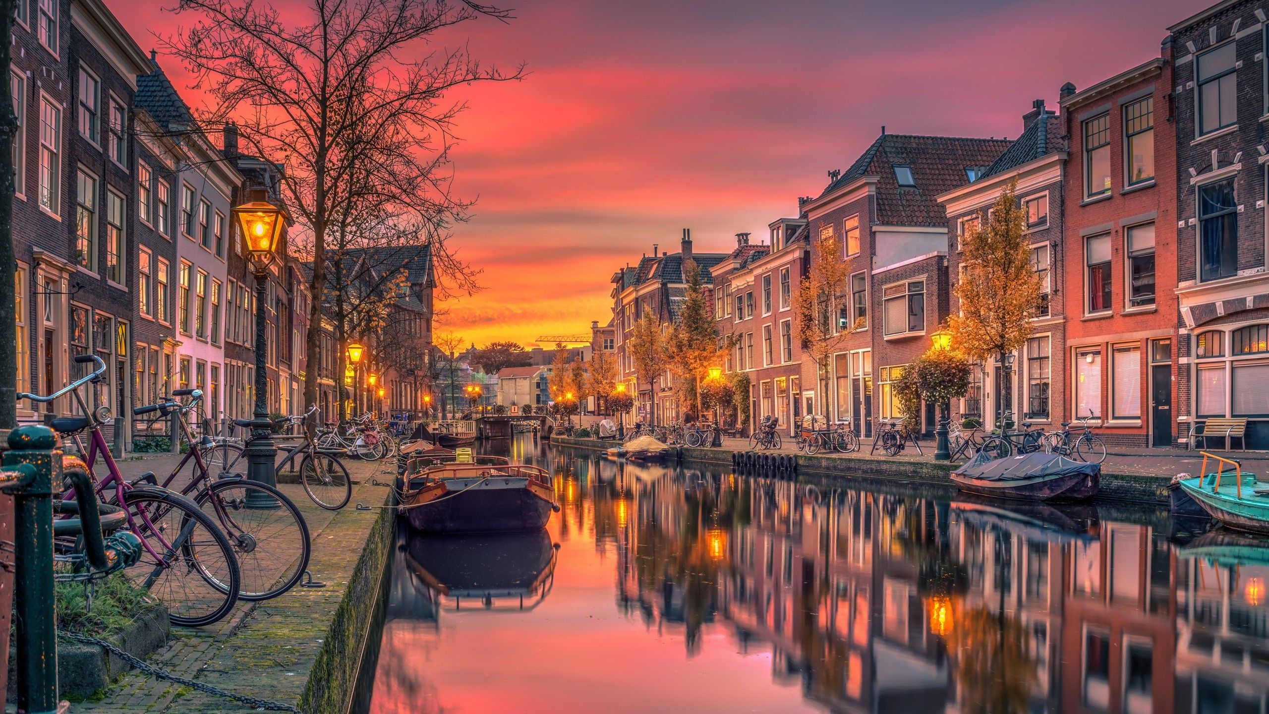 Download 2560x1440 Netherlands, River, Buildings, Sunset, Holland