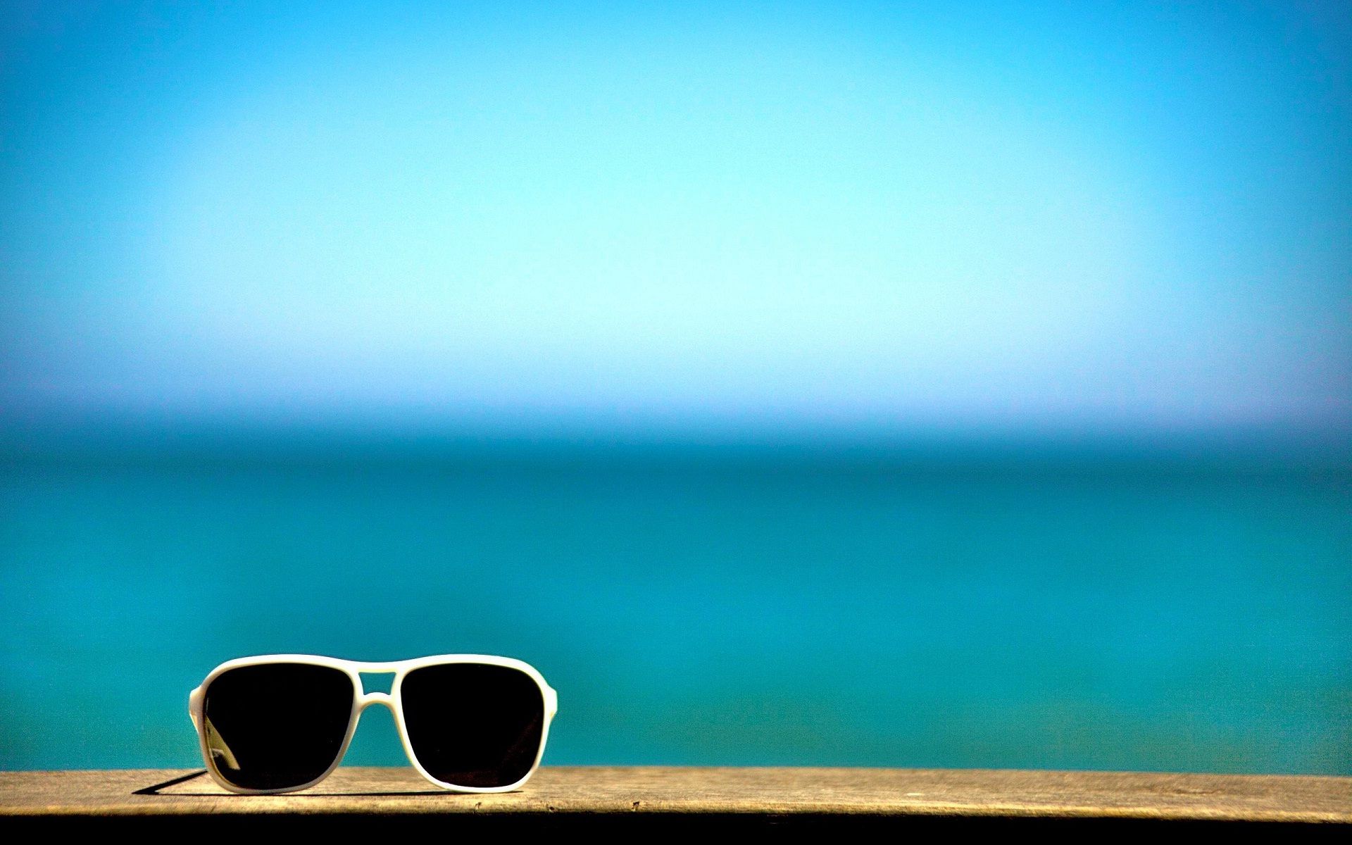 Stylish Black Goggles At Beach Happy Wallpaper Time