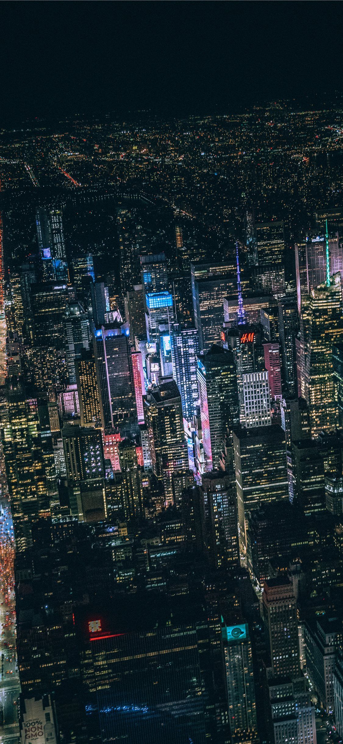 aerial view of city buildings during night time iPhone X Wallpaper Free Download