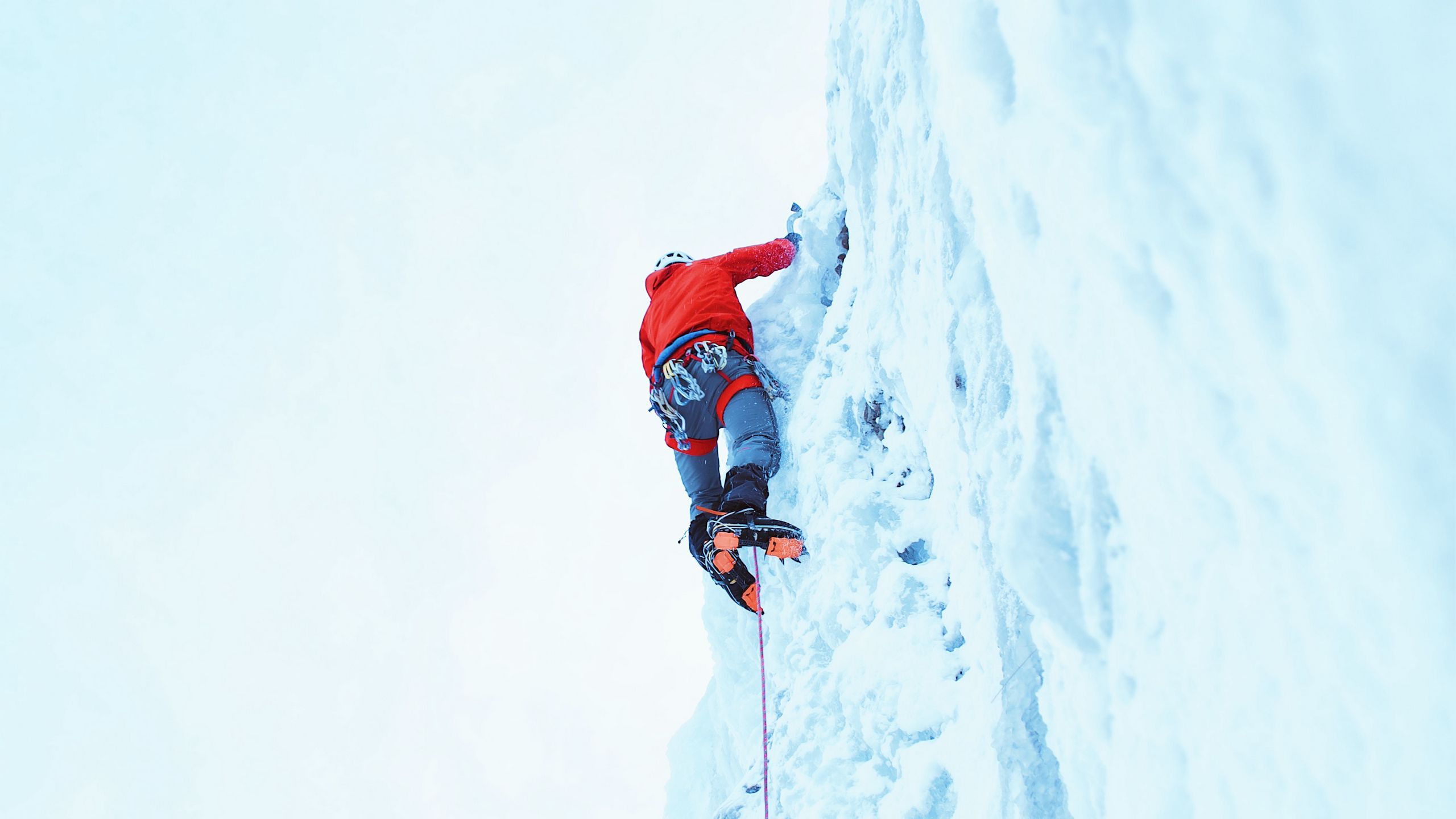 Download wallpaper 2560x1440 climber, snow, mountain, climbing