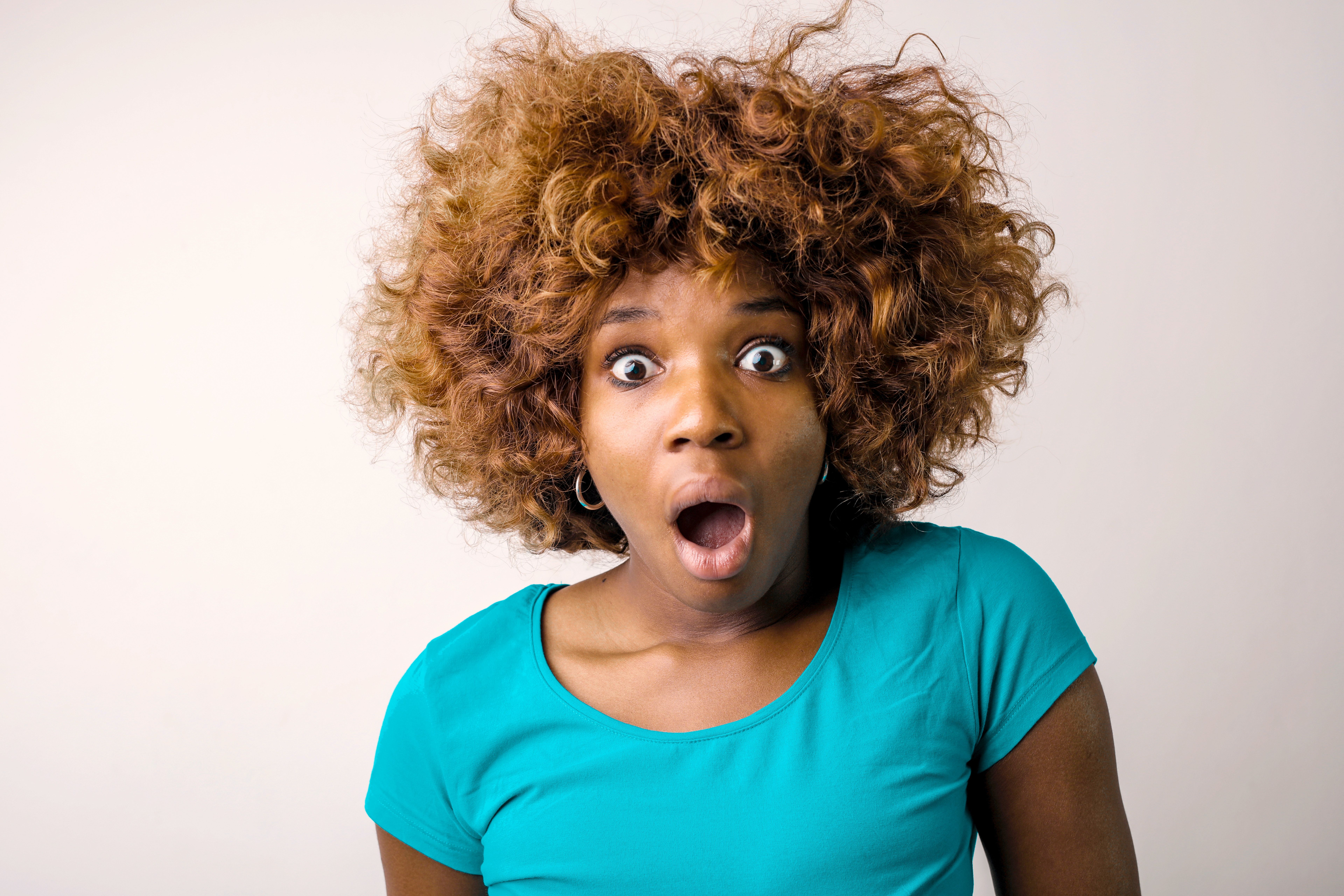 Portrait Photo Of Shocked Woman In Blue T Shirt Standing In Front