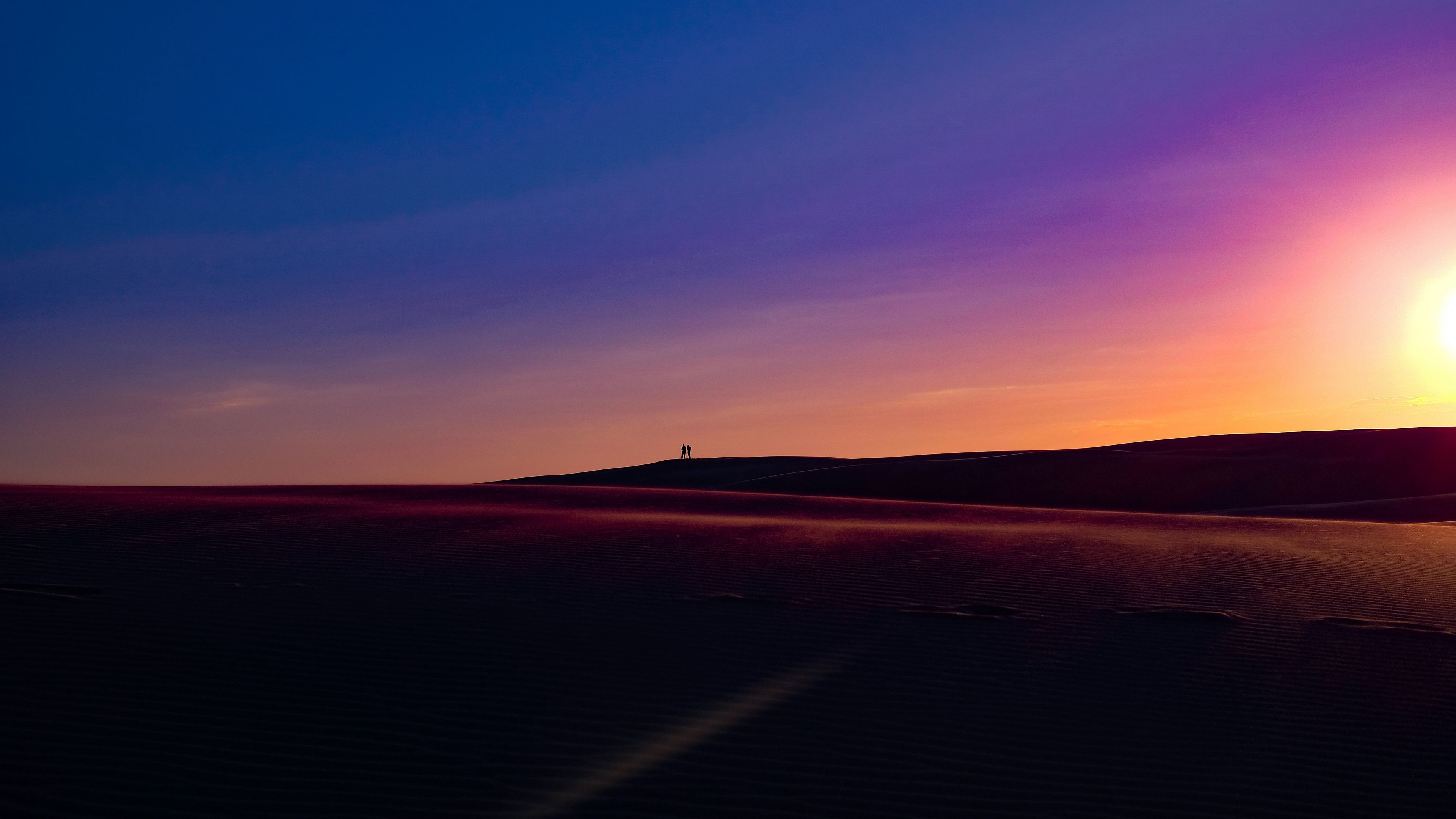 Download wallpaper 3840x2160 sunset, dunes, silhouettes, sand