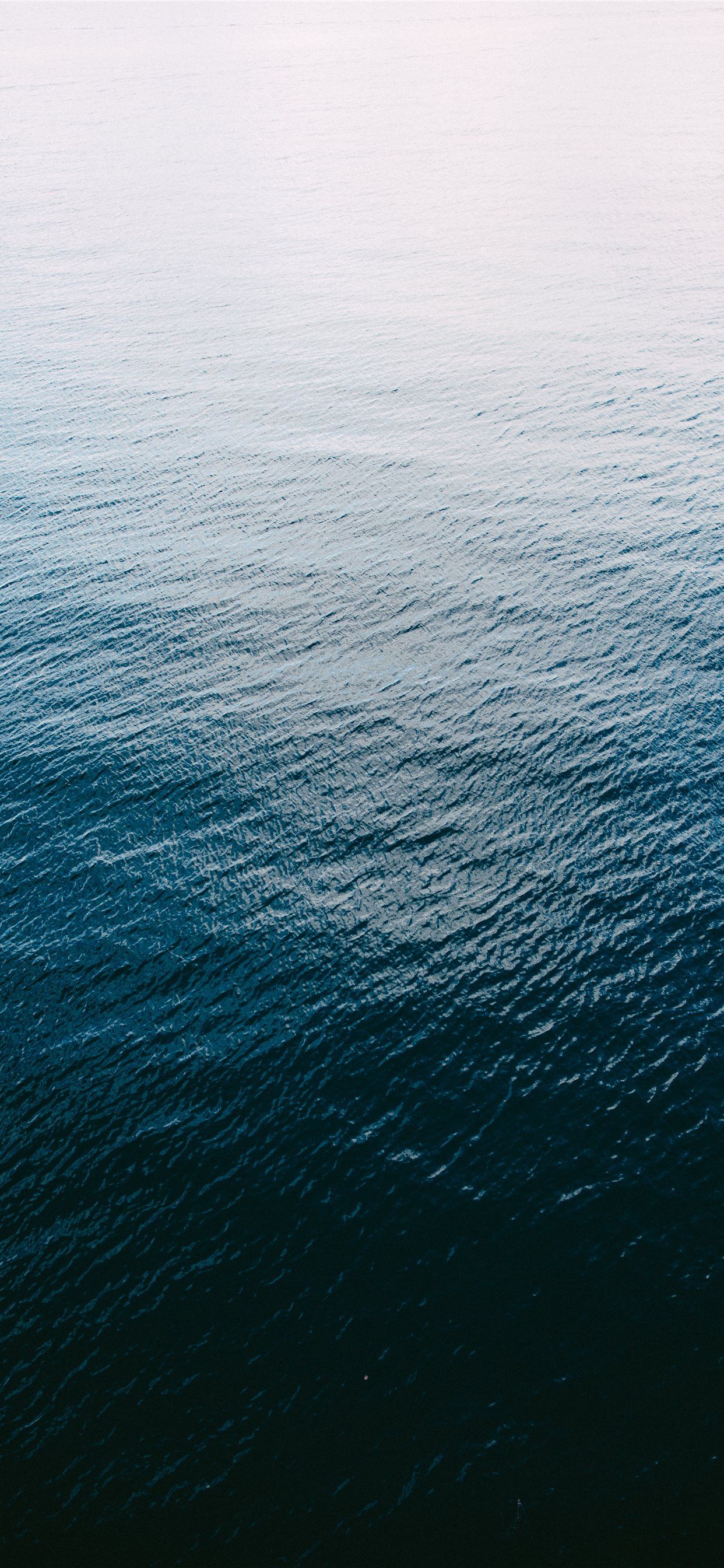 A shot of the Pacific Ocean from above iPhone Wallpaper Free Download