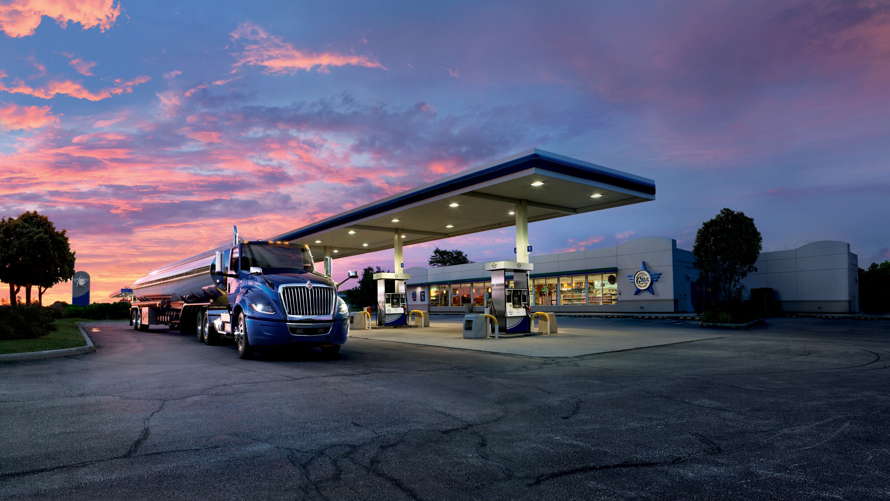 Big blue truck at the gas station wallpaper and image