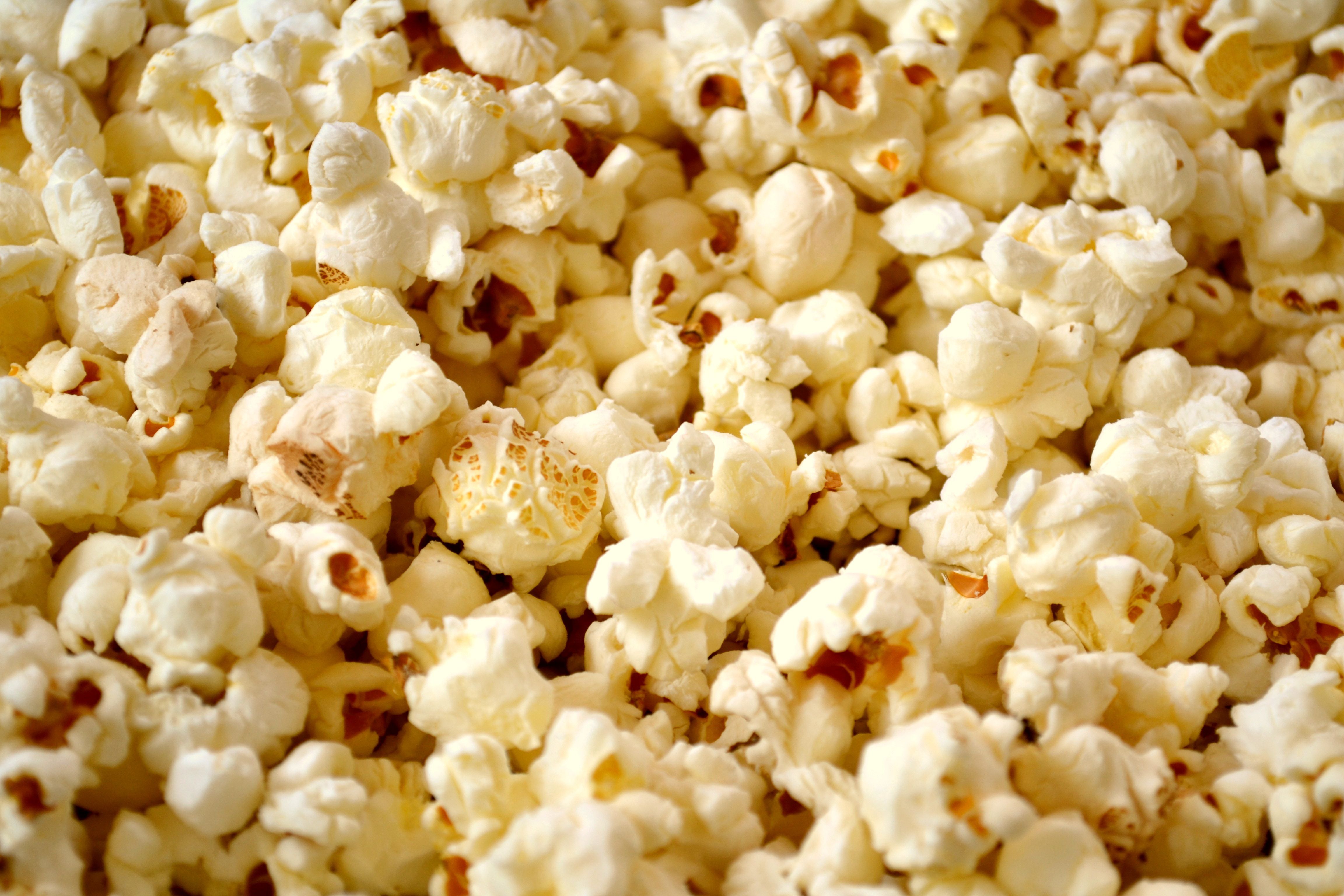 A snack of delicious popcorn 4k Ultra HD Wallpaper. Background