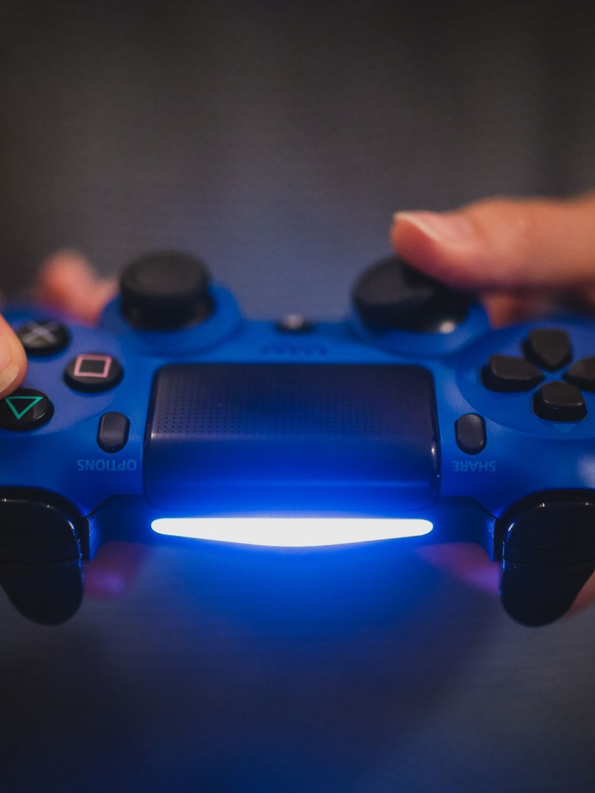 Person Holding Blue Sony Ps4 Controller HD Wallpaper Games