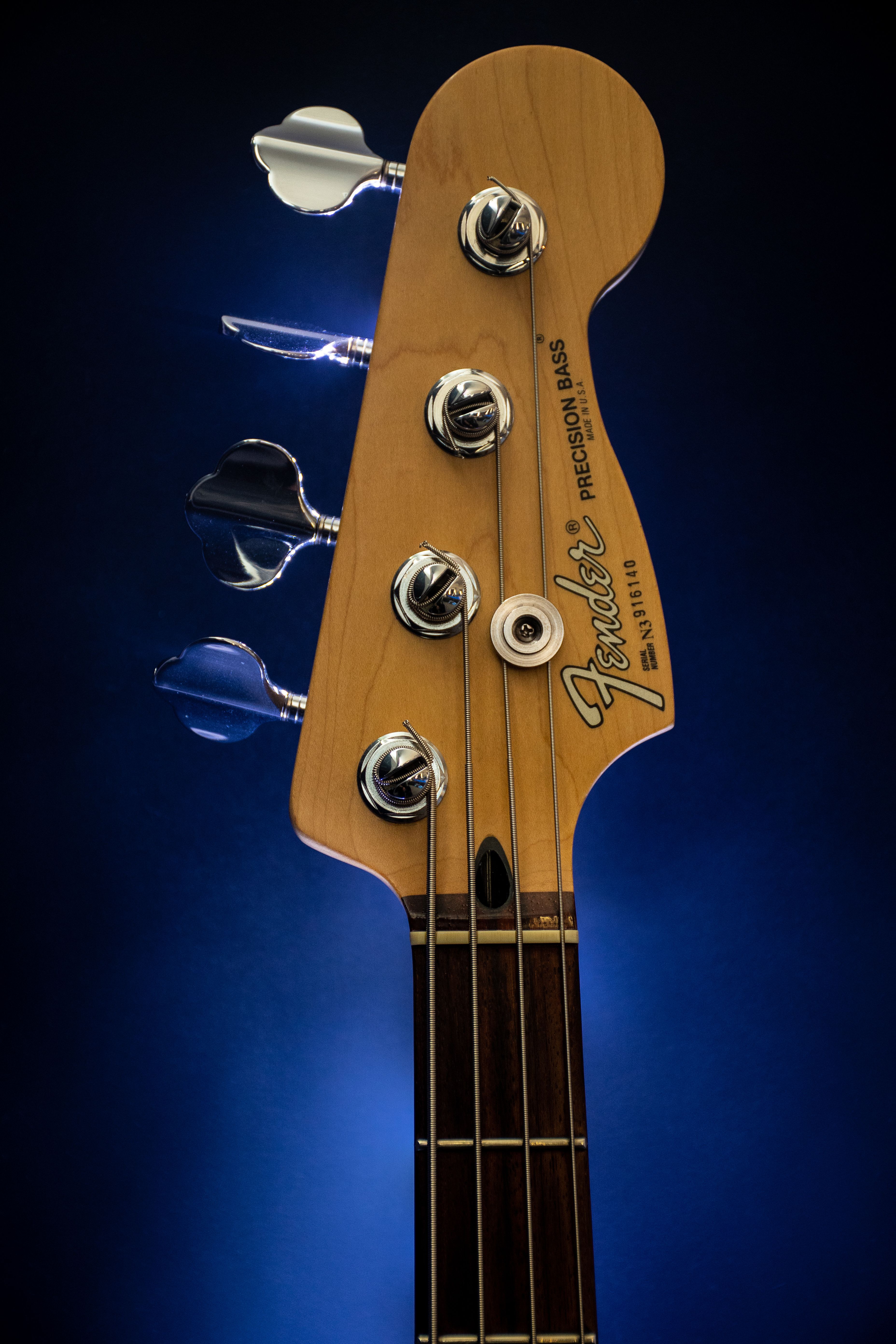 Close Up Photography Of Brown Fender Guitar Headstock Wallpaper