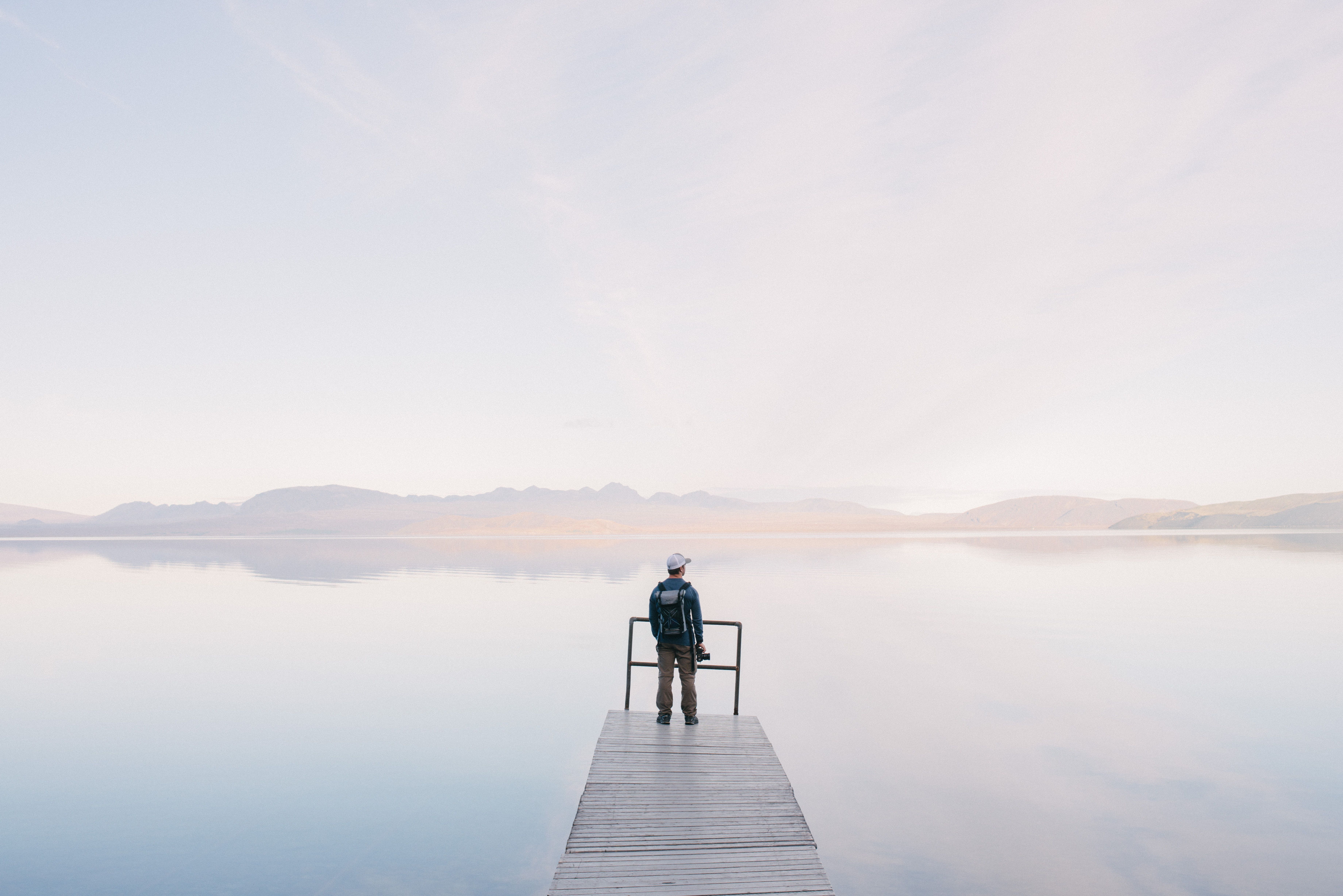 Free photo: Man Wearing Jacket Standing on Wooden Docks Leading to