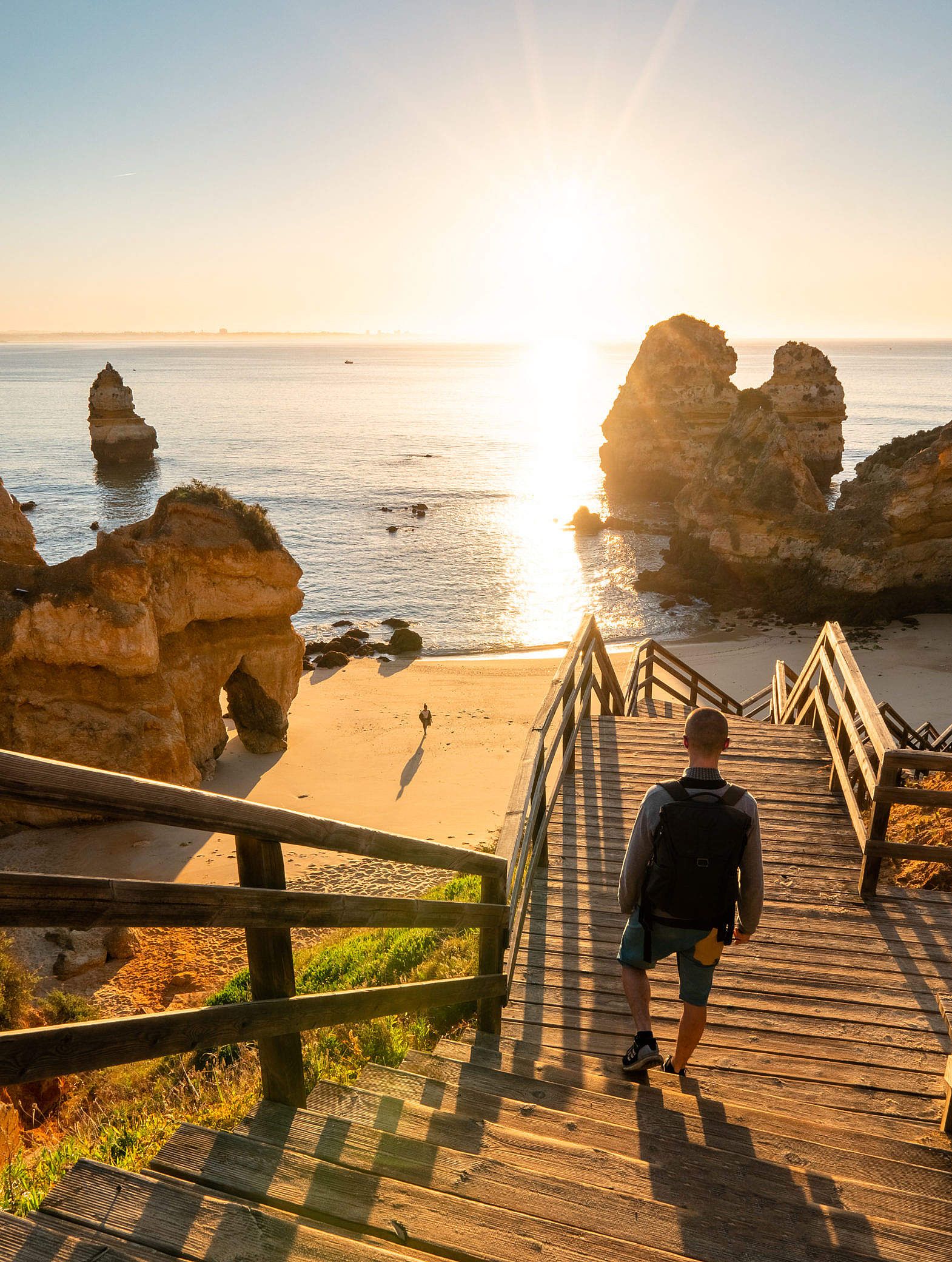 Couple on a Beach Enjoying Sunrise Free