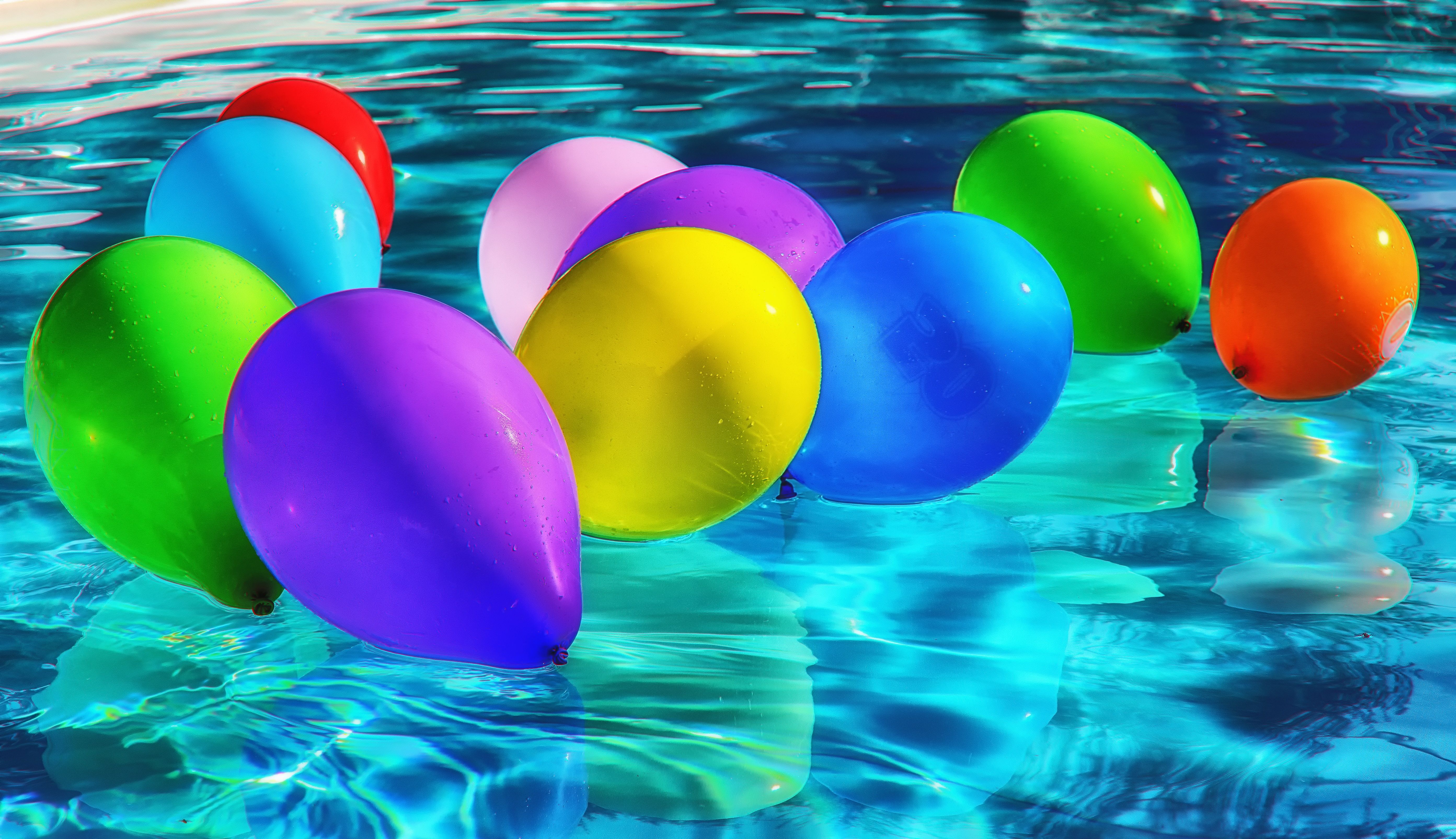 Colorful balloons in the pool summer wallpaper