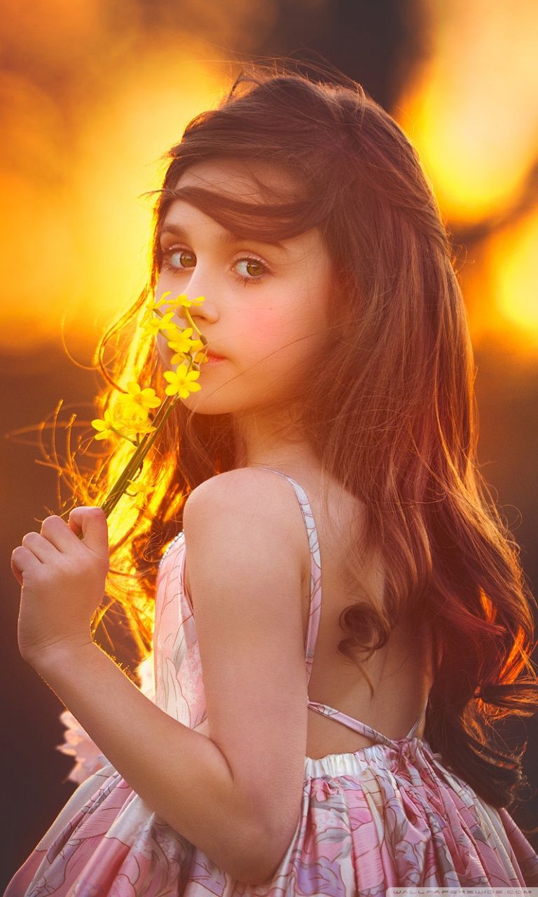 Cute Girl Smelling a Flower Ultra HD Desktop Background Wallpaper