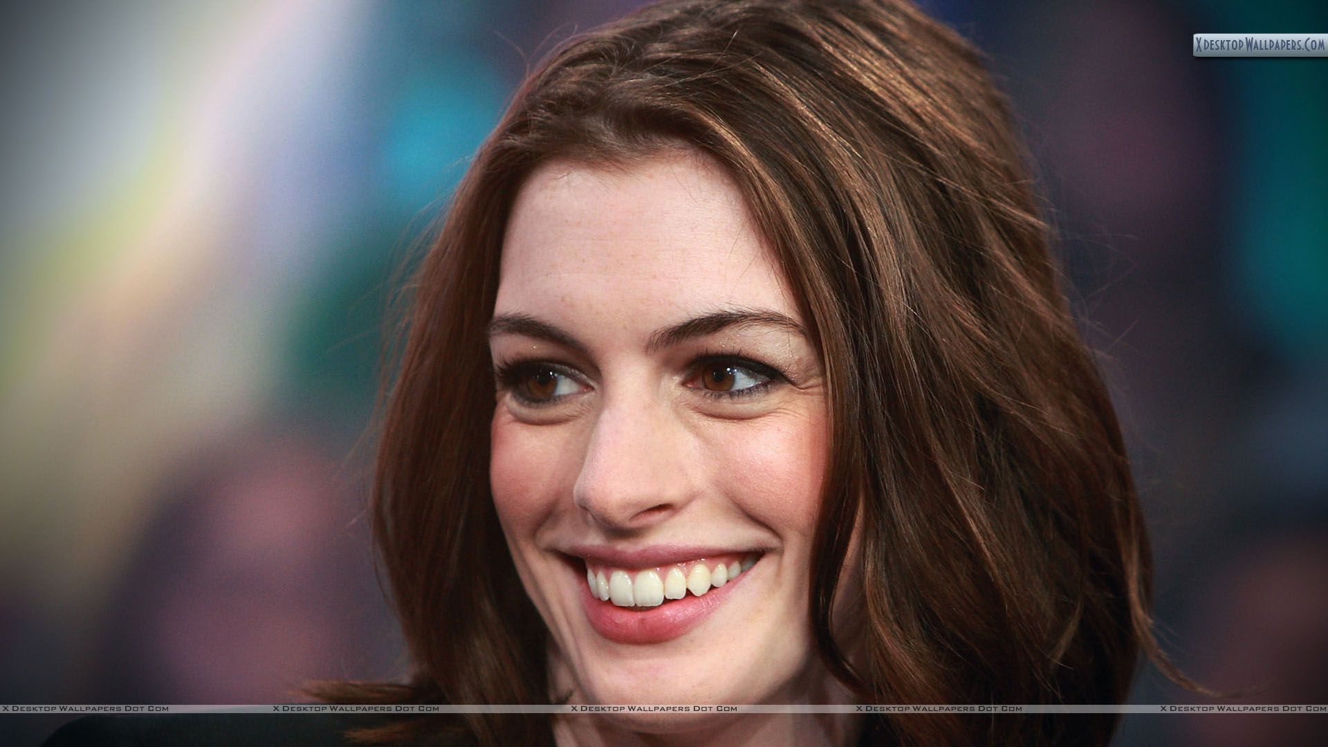 Anne Hathaway Smiling Side Face Closeup Wallpaper
