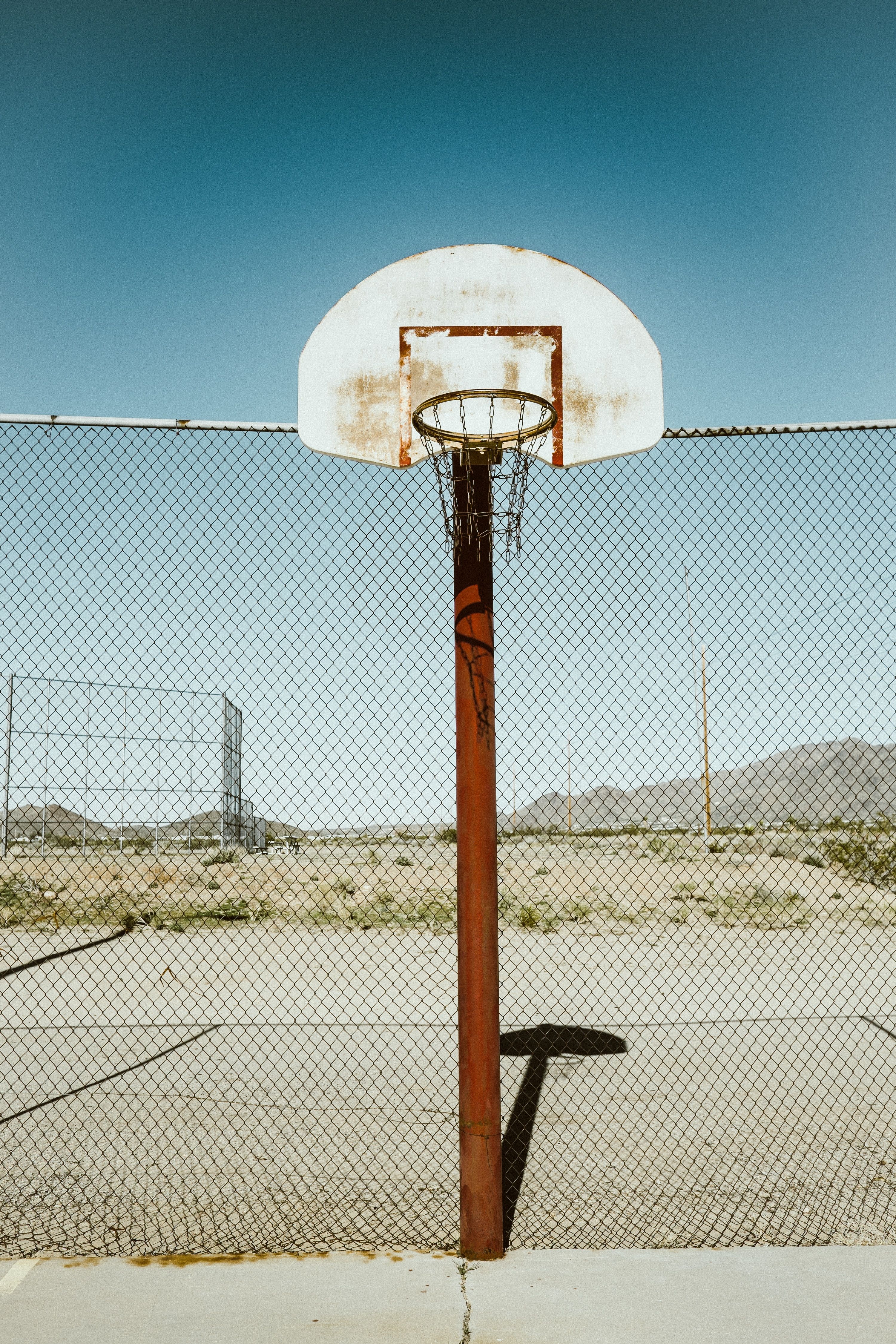 Download wallpaper 3000x4500 basketball court, old, grid, fence HD