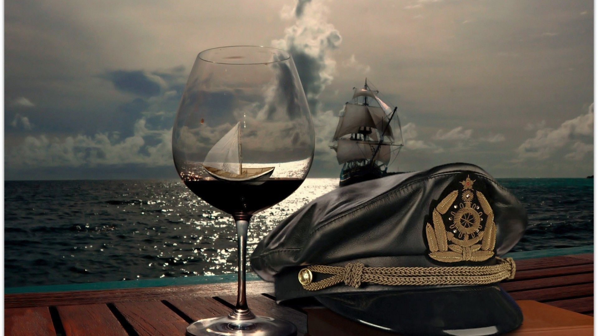 Sailboat, ocean, glass of wine