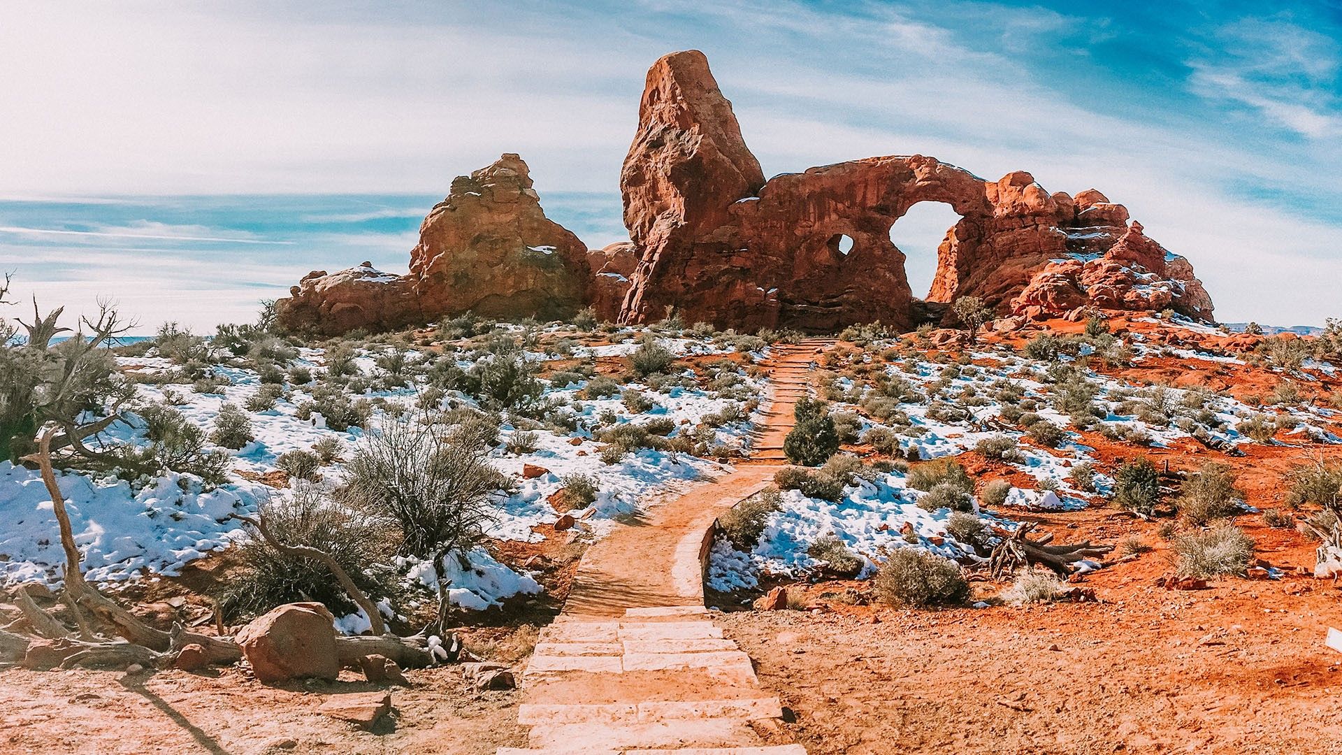 Turret arch in Arches national park in spring with snow, Moab