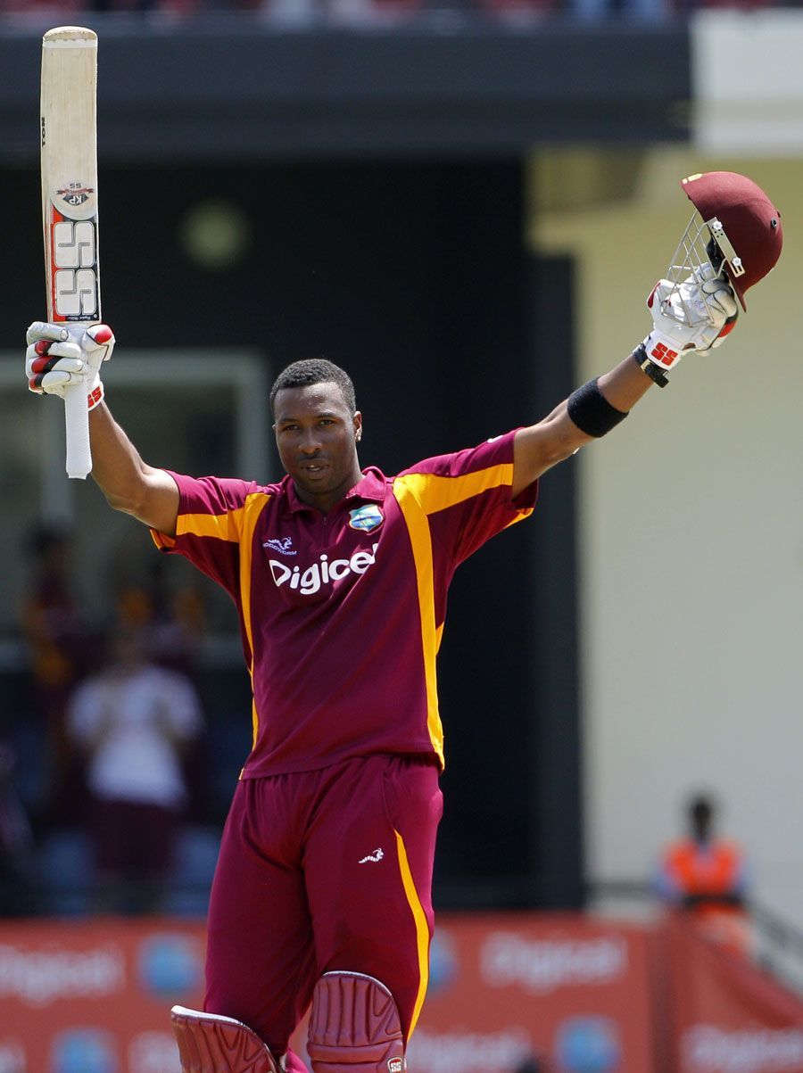 Kieron Pollard of West Indies celebrates reaching his hundred vs